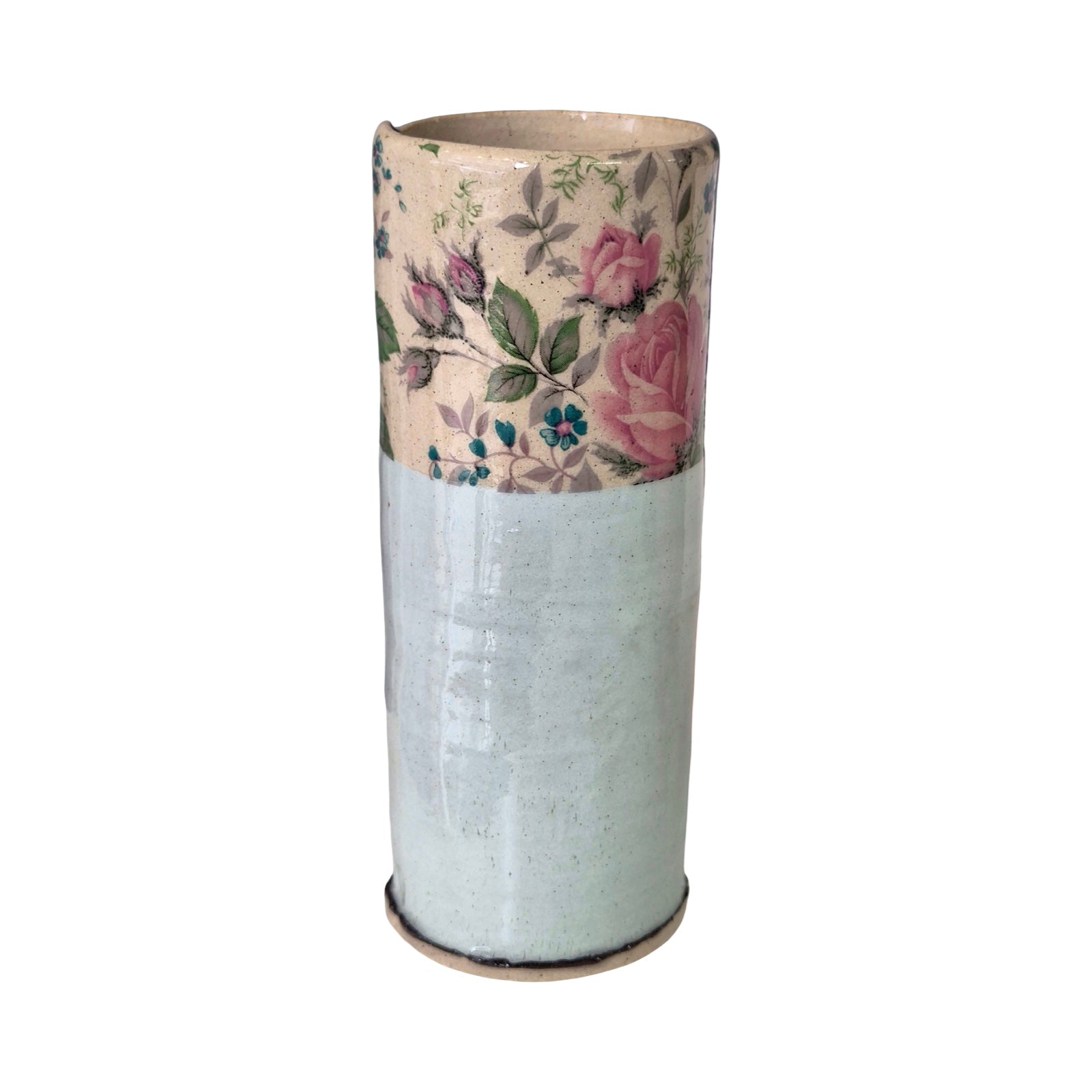 Cylindrical vase with floral patterned top section on a white background.