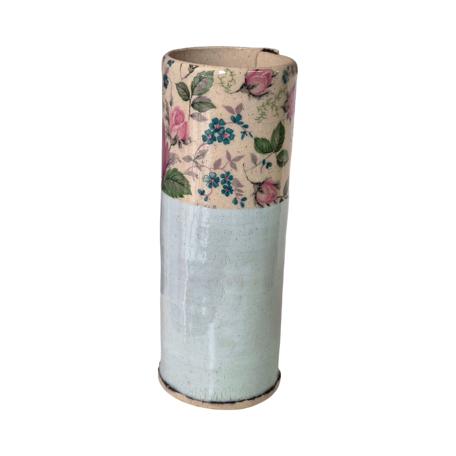 Cylindrical vase with floral pattern on a white background.