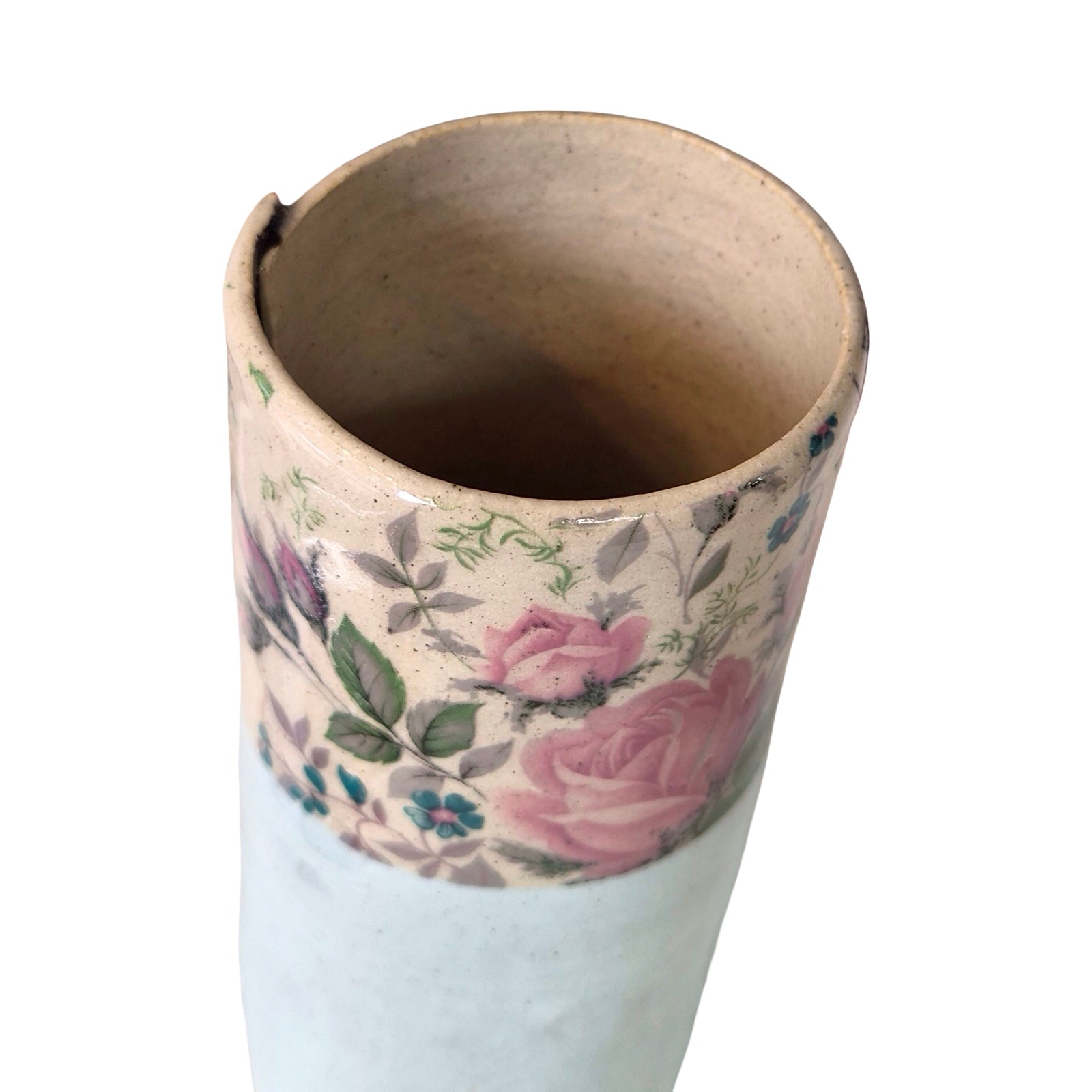 Cylindrical vase with floral design on a white background.