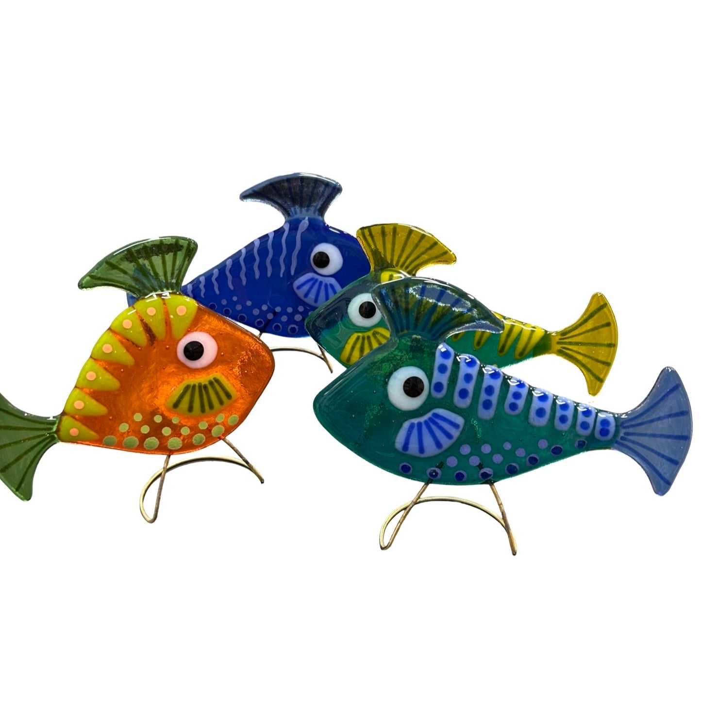 Colorful glass fish-shaped decorations on a white background.