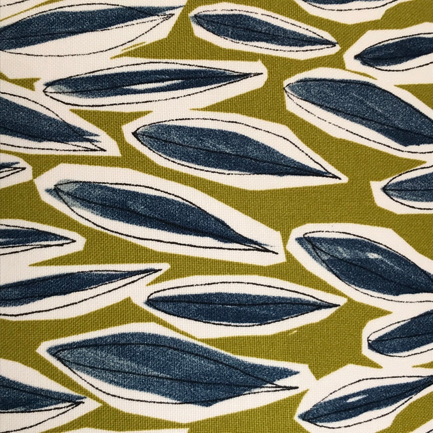 Dull lime green fabric with blue leaves with white surroundings.