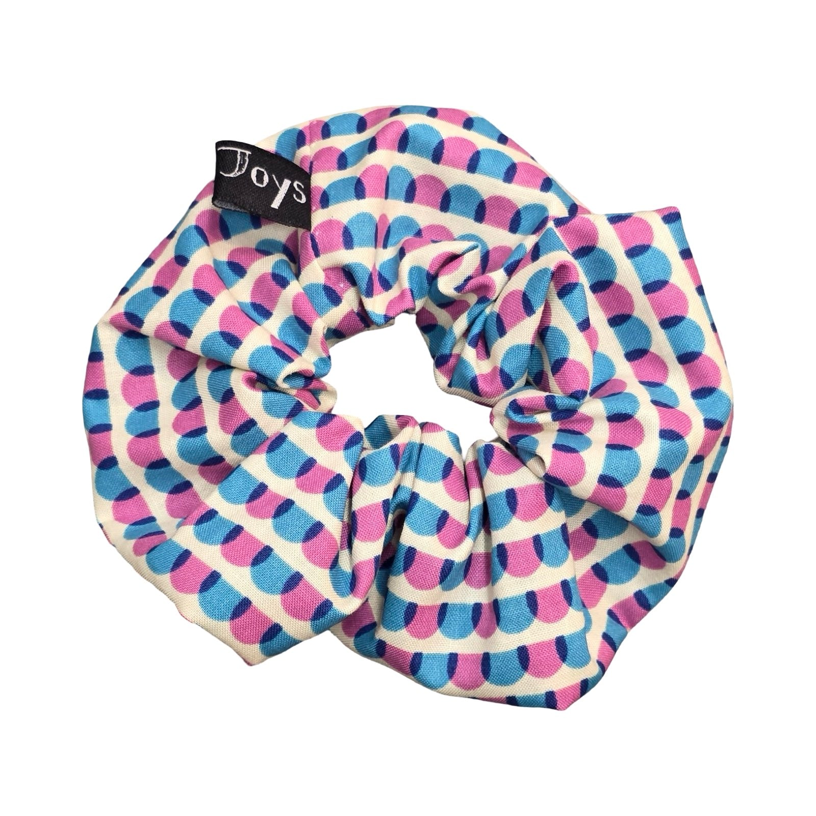 This handmade hair scrunchie is made from 100% cotton fabric with a blue and pink scalloped pattern.