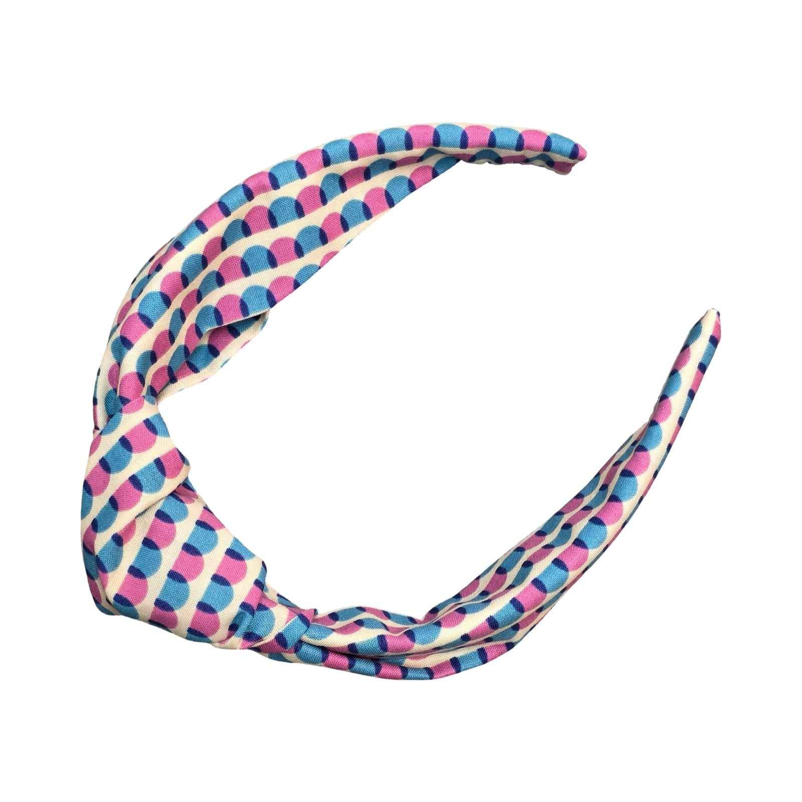 This handmade floral top-knot Alice band is made from 100% cotton fabric with a blue and pink scalloped pattern.