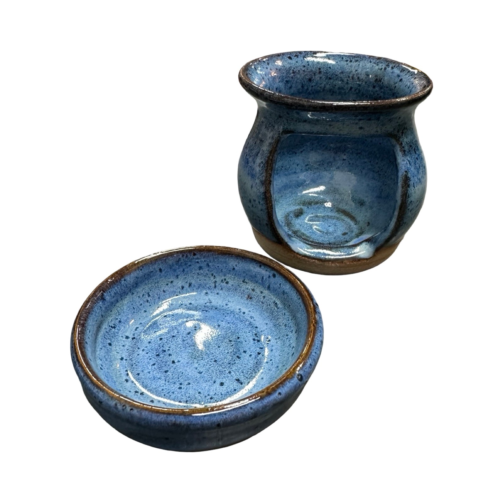 Blue ceramic oil burner and top on a white background.