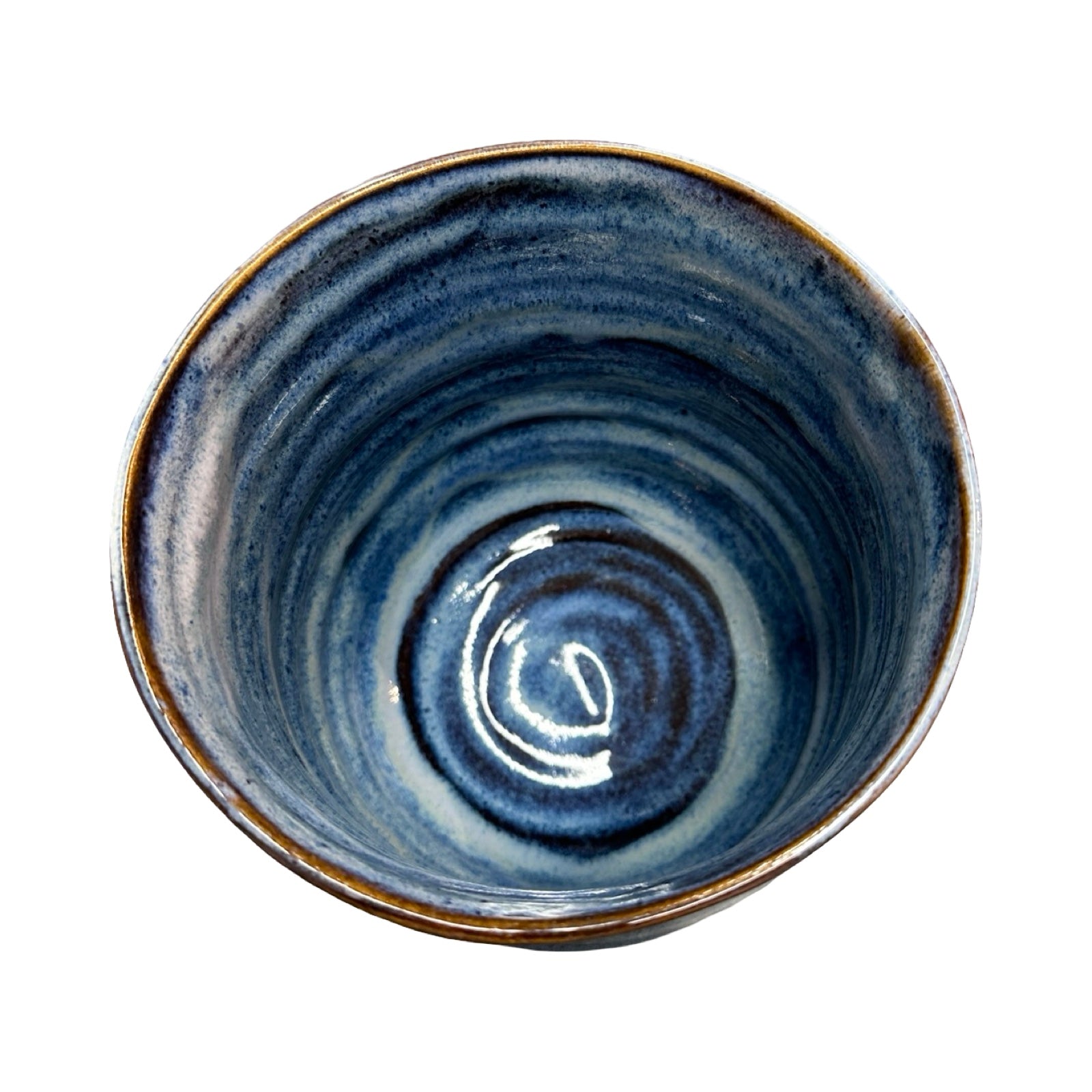 Blue ceramic bowl with a textured surface on a white background.