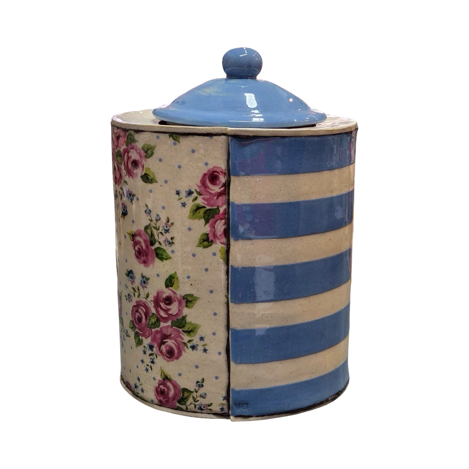 Cylindrical ceramic jar with floral and striped design on a white background.