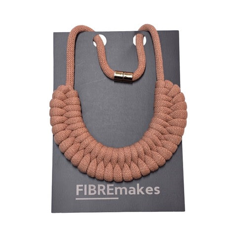 A hand-knotted style necklace made by hand from 100% recycled blush pink cotton cord with a magnetic metal fastening.
