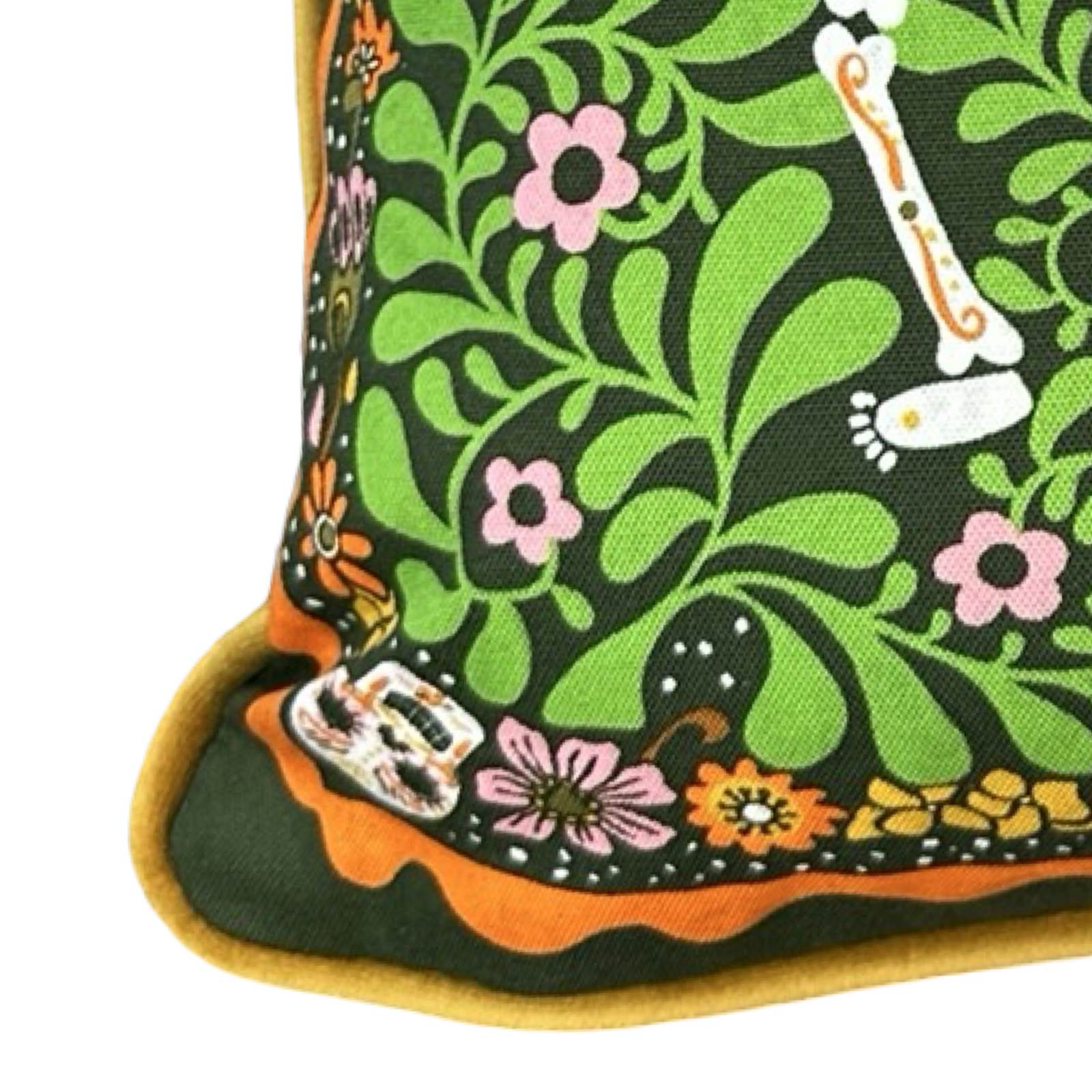 Colourful cushion cover featuring skeletons dancing surrounded by multicoloured flowers and skulls. The cushion is trimmed with handmade velvet piping and backed with luxurious orange velvet.