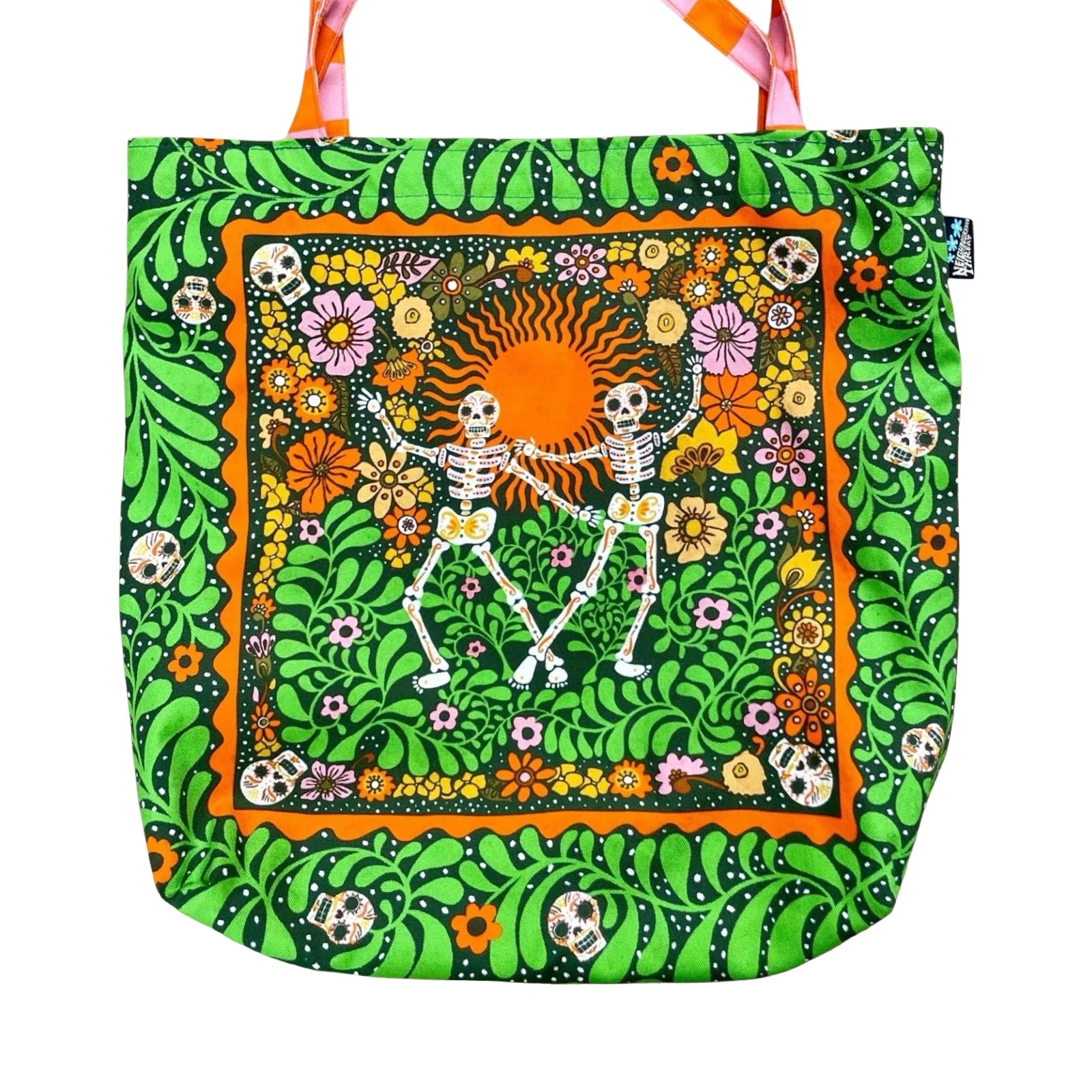 Fabulous tote bag featuring black labradors, orange dachshunds and green scottie dogs with green leaves and a lilac background with orange and white checked cotton handles.