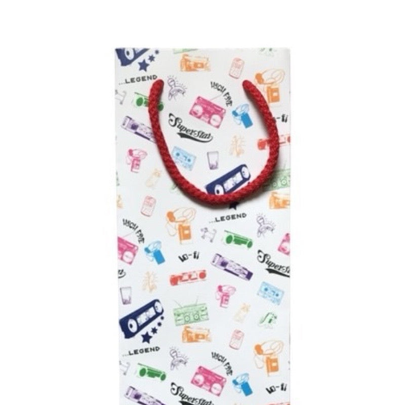 White bag with colourful boom box designs and a red handle on a white background.