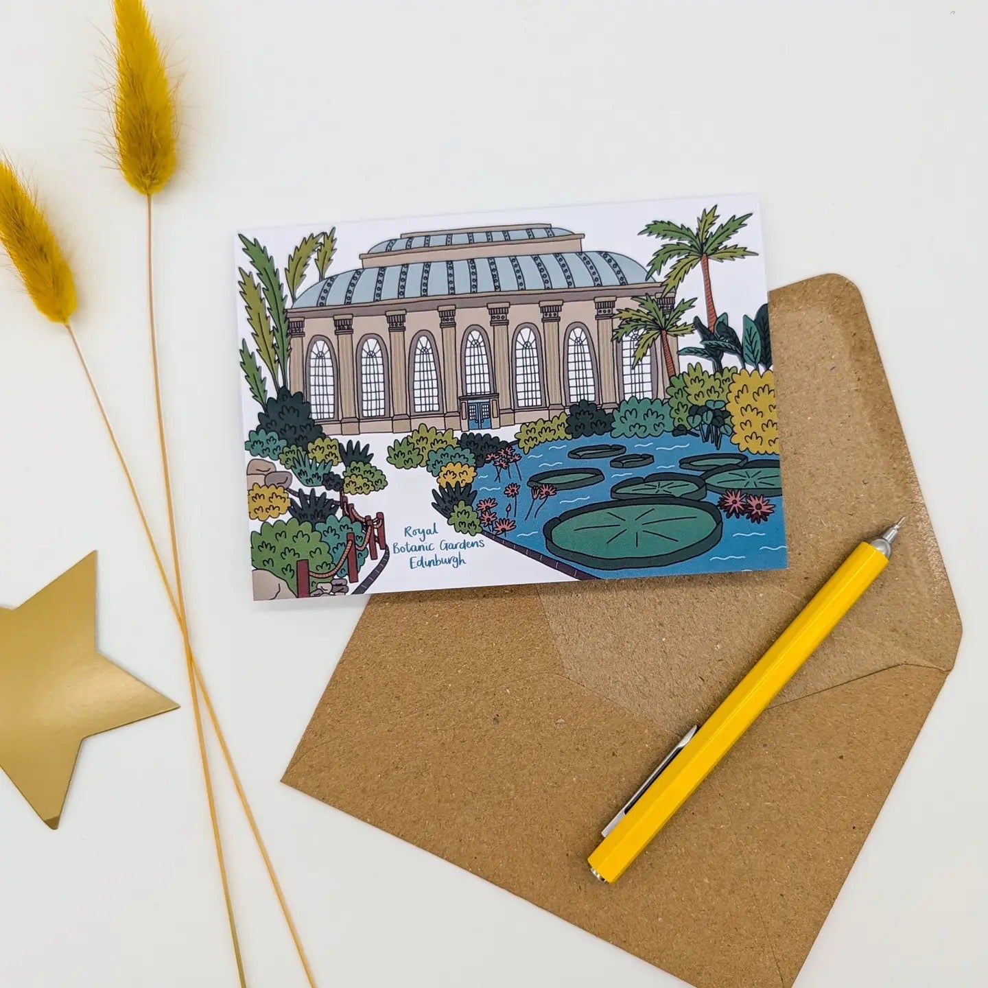 Greeting card with botanical garden illustration on a white background with a brown envelope, yellow pen, flower and star.