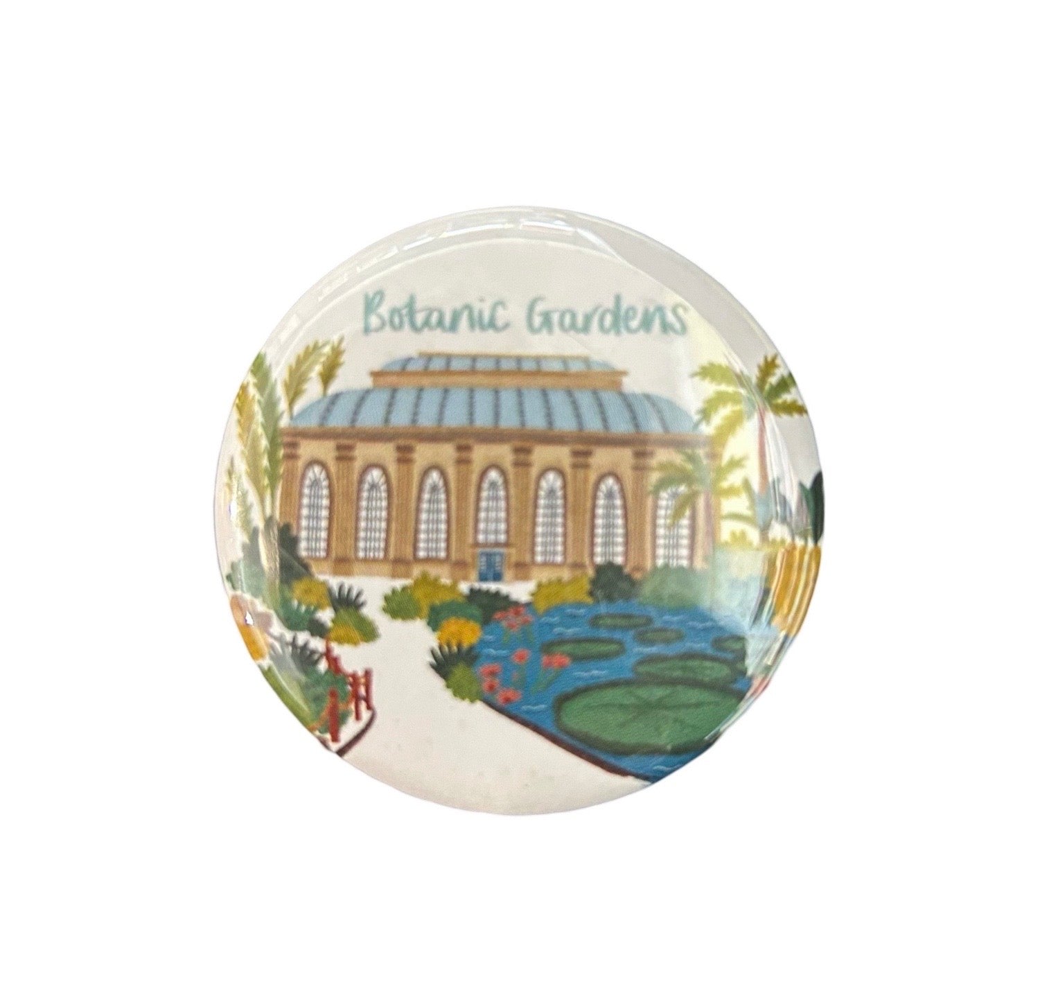 A round magnet with an illustration of the Botanic Gardens in Edinburgh, featuring a building, trees, and the text 'Botanic Gardens'.
