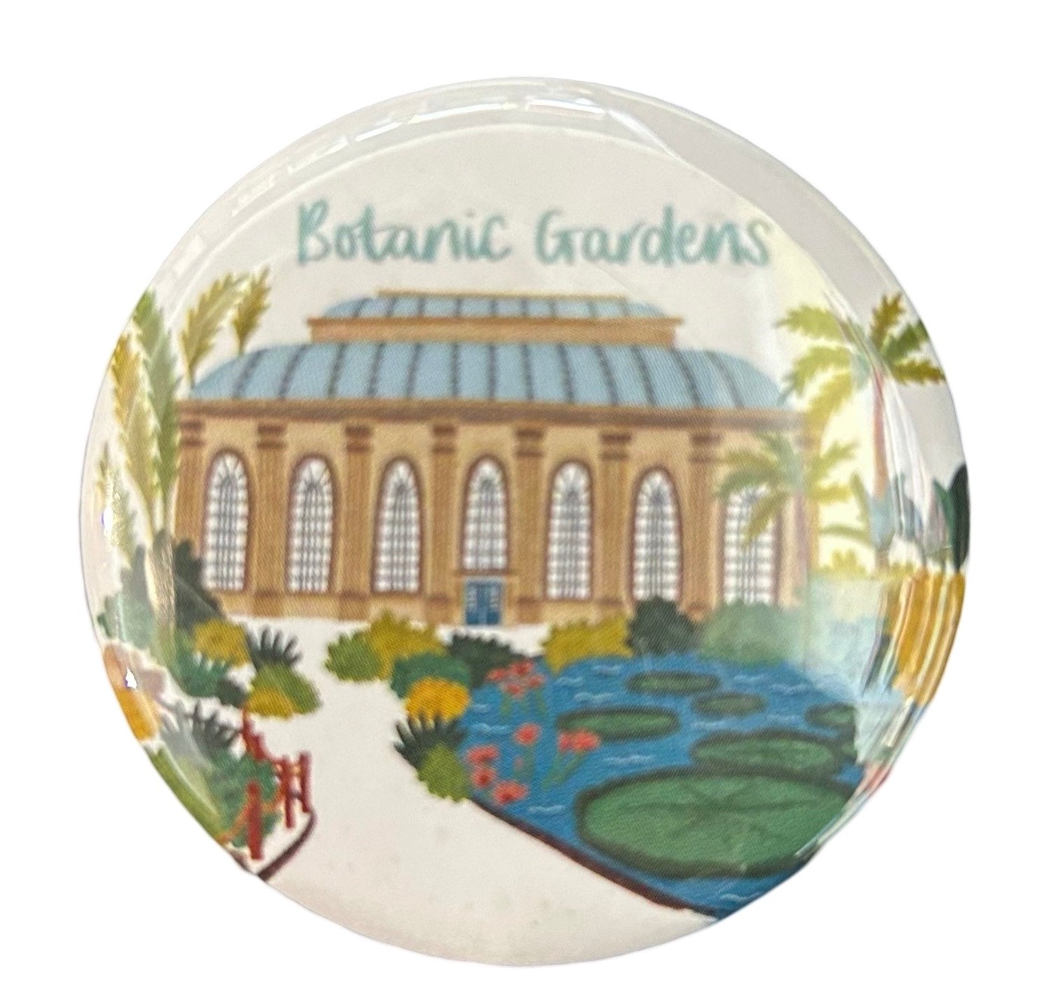 A round magnet with an illustration of the Botanic Gardens in Edinburgh, featuring a building, trees, and the text 'Botanic Gardens'.