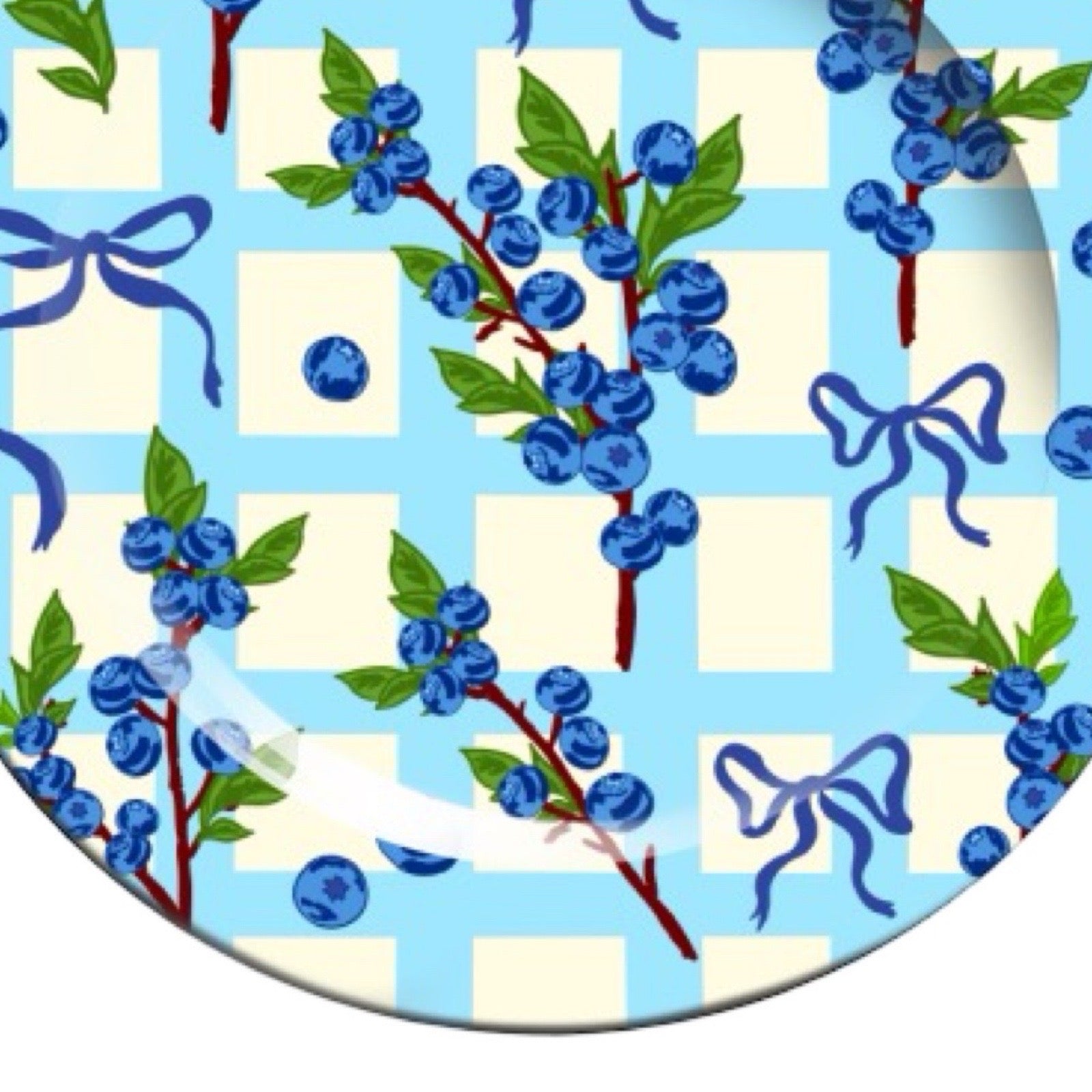 Pattern with blue berries, green leaves, and blue ribbons on a checkered background.