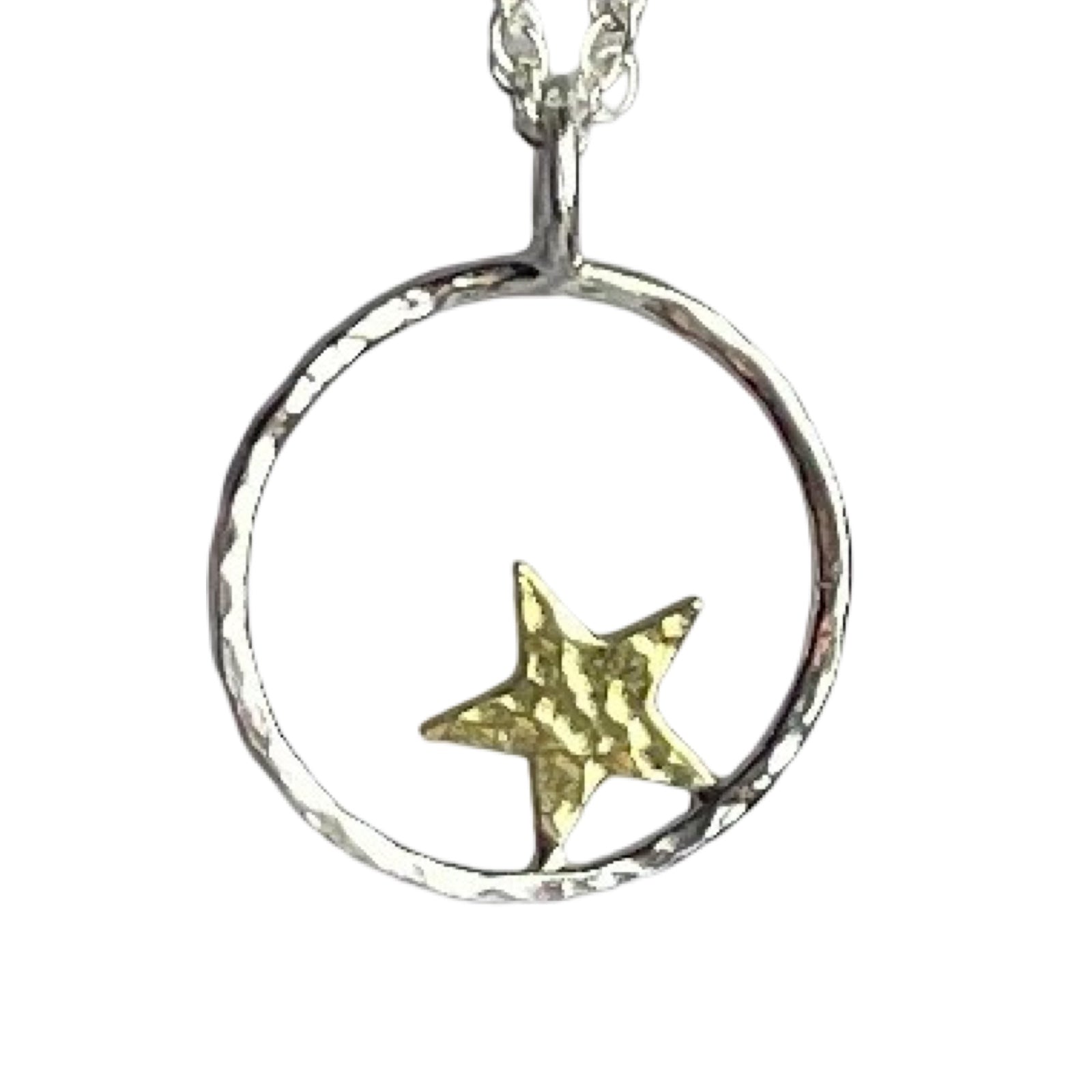 Silver necklace with a circular pendant featuring a gold star on a white background.