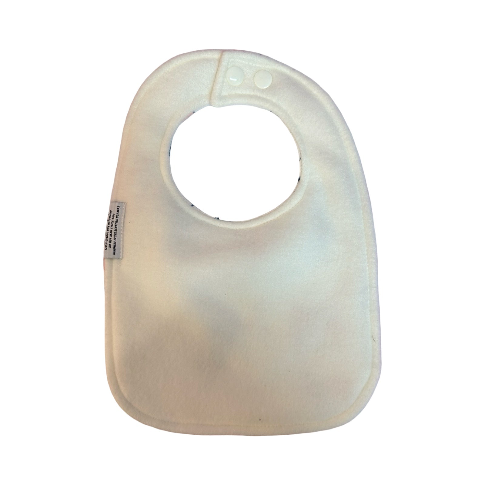 Baby bib with a label on a white background.