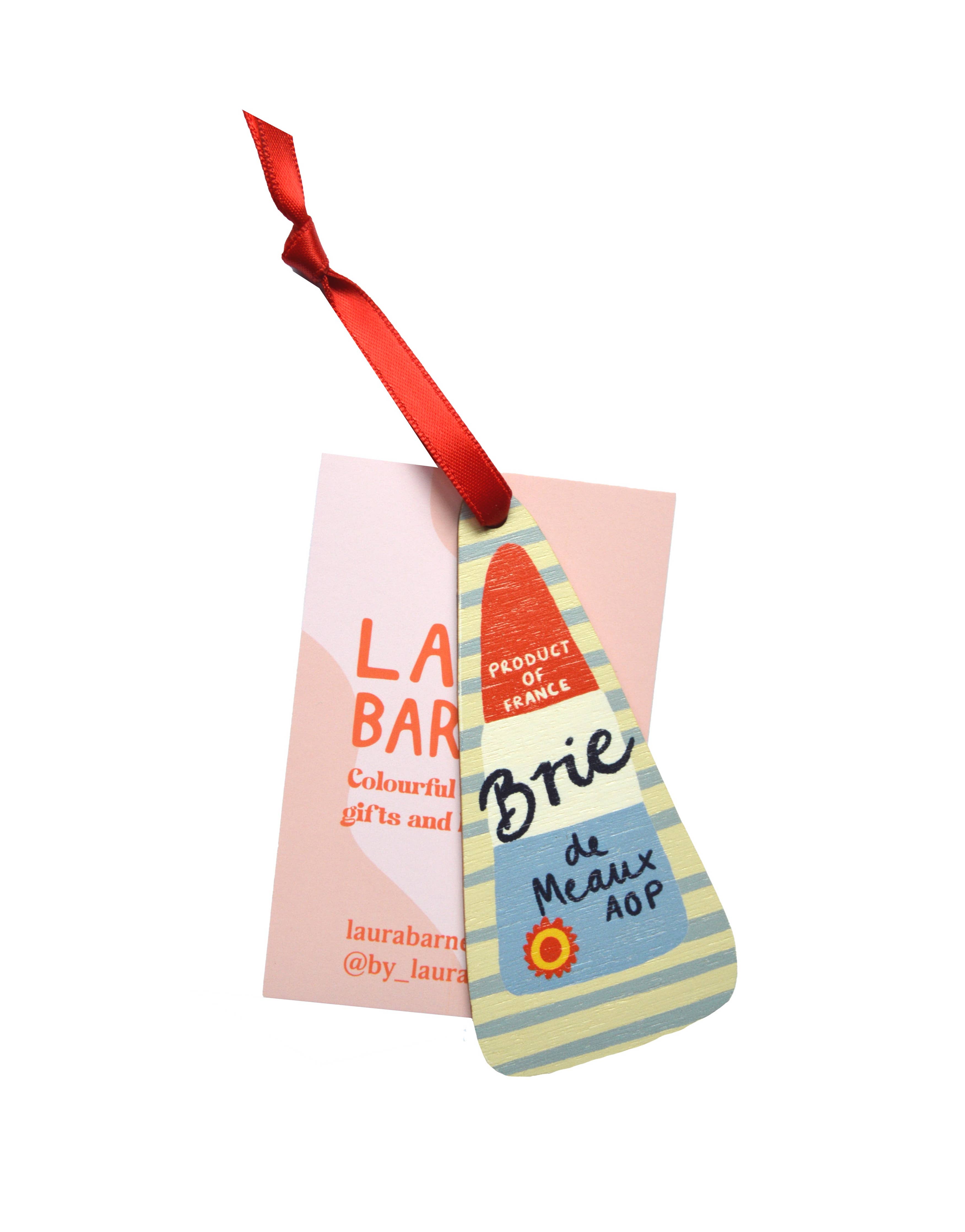 Colorful packaging with a red ribbon on a white background.