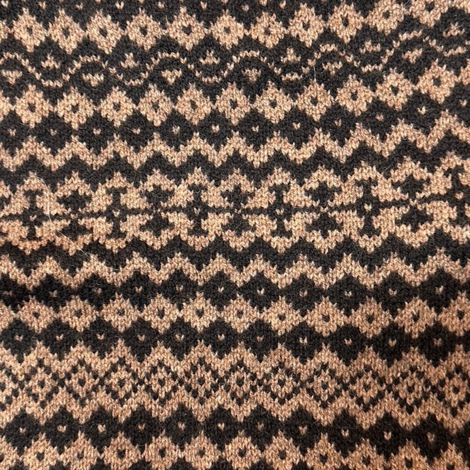 Super soft and cosy 100% lambswool knitted snood in a brown and black geometric stripes design.