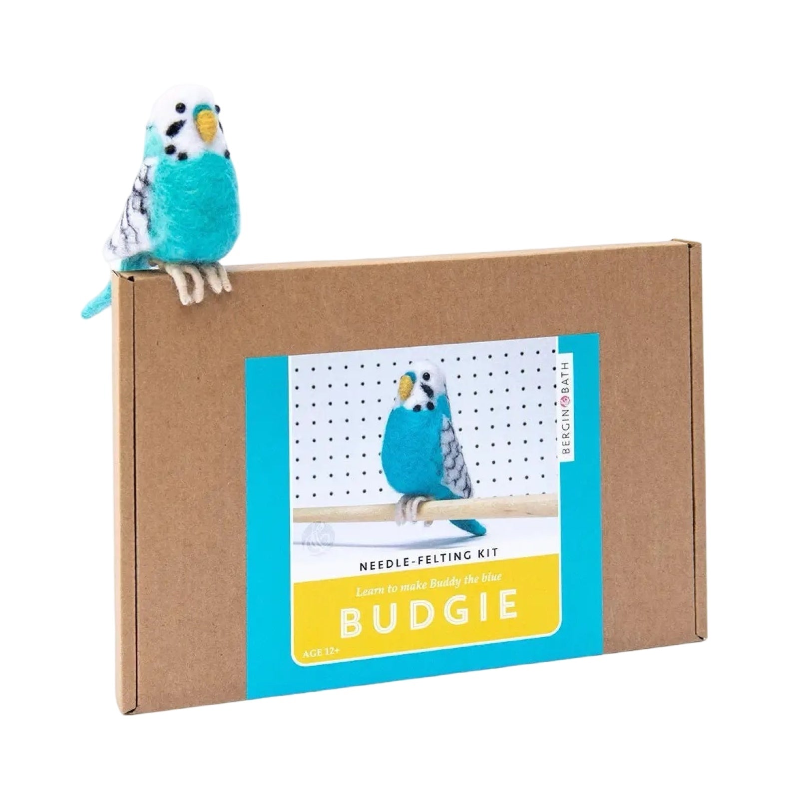 A brown box with a picture of a blue felted budgie sitting on a cane.