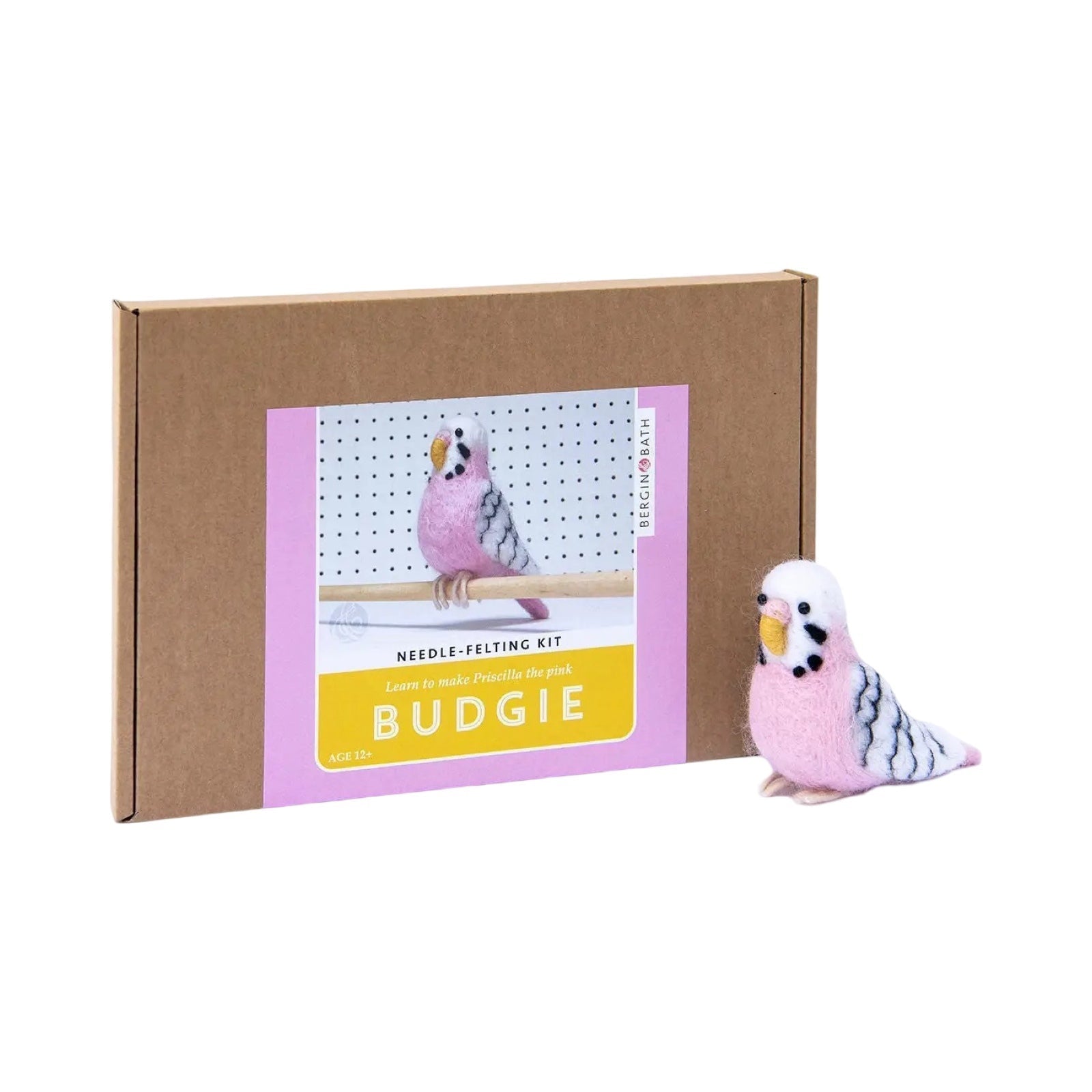 A brown box with a picture of a blue felted budgie sitting on a cane.