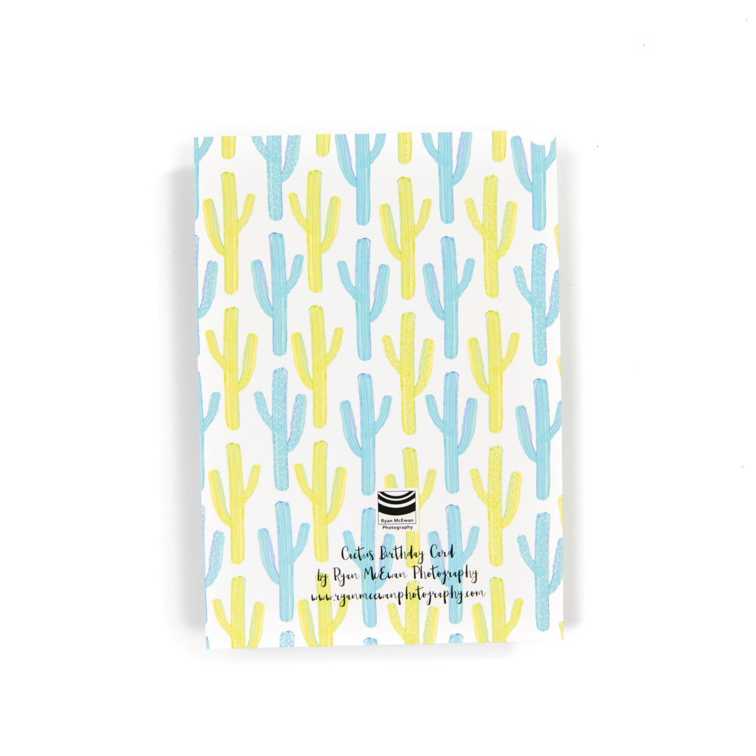 The back of card with a cactus design. 