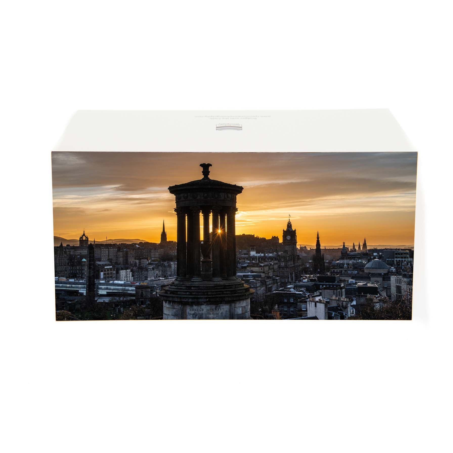 An view of the Edinburgh skyline at sunset from Calton Hill on a card. 
