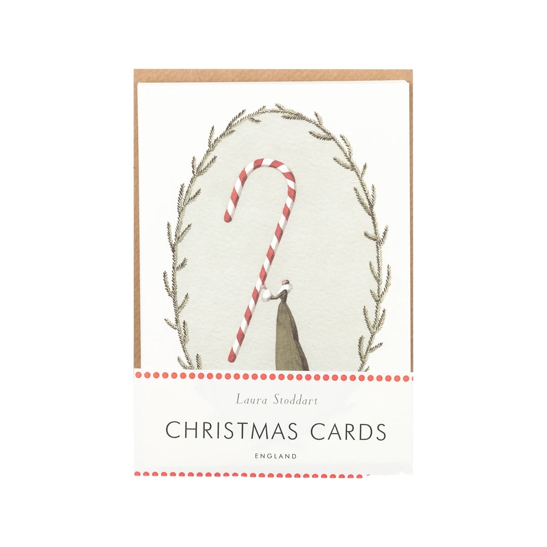 Pack of 10 Christmas cards featuring a lady in a beautiful green dress holding a giant red and white striped candy cane.