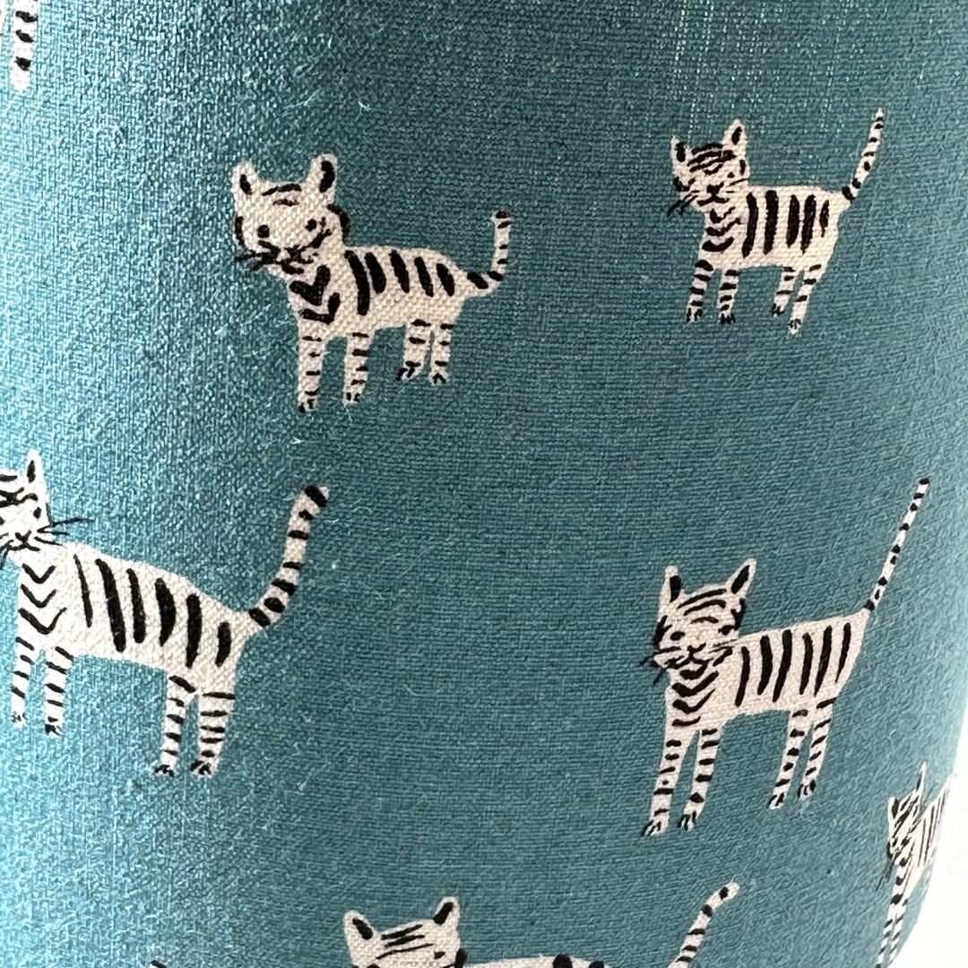 Blue fabric with a black and white cats