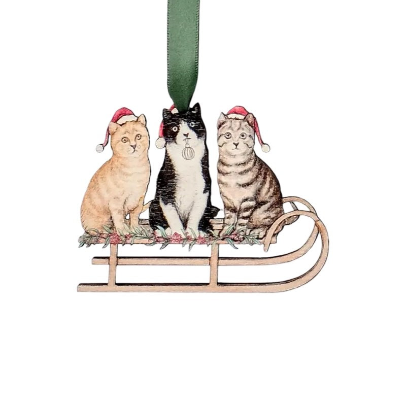 Wooden Christmas decoration of 3 cats on a sleigh. 
