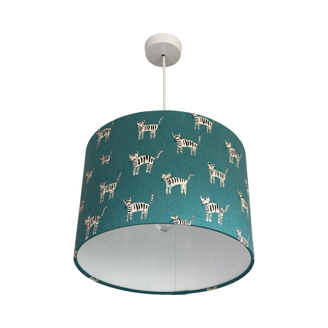 Drum lampshade in teal with small hand drawn black and white cats.