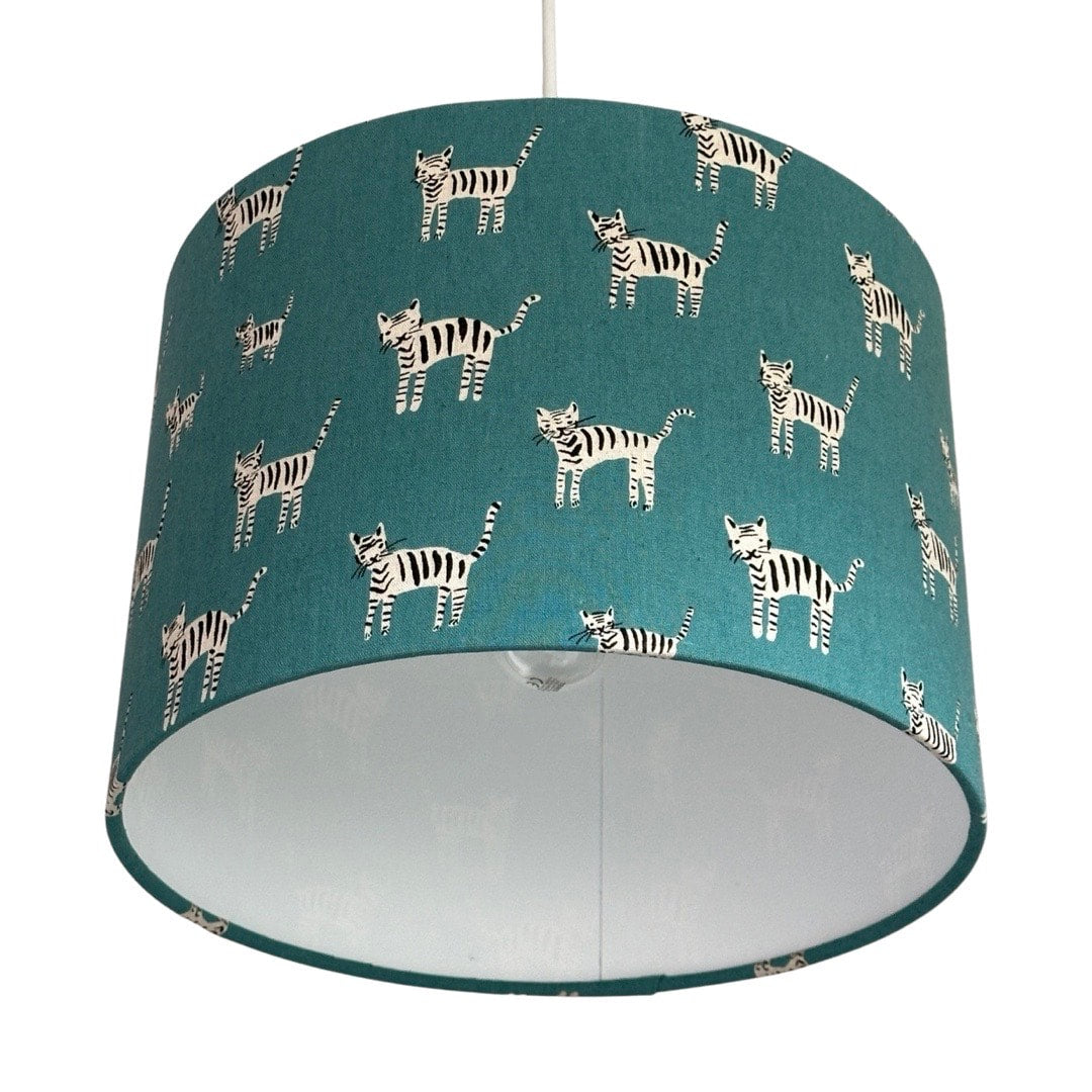 Drum lampshade in teal with small hand drawn black and white cats.