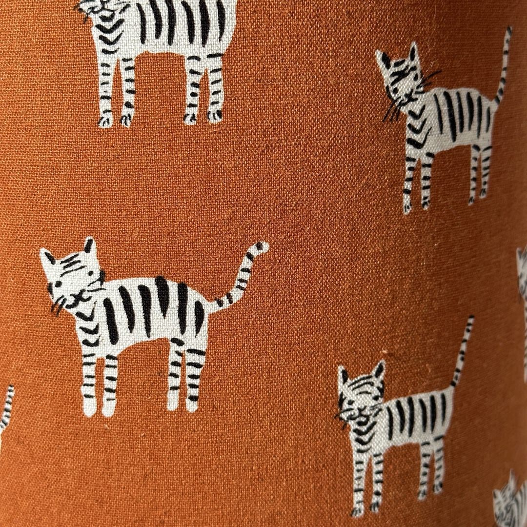 Mustard fabric with a black and white cats