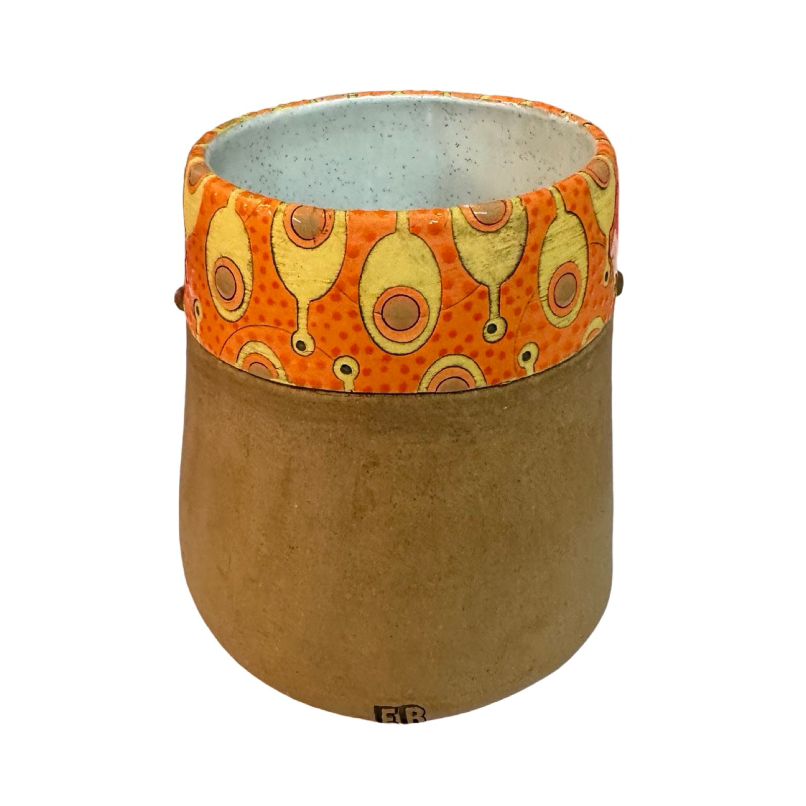 The back of a ceramic beaker with a male moustached face and a mustard and brown paddles pattern on an orange background.