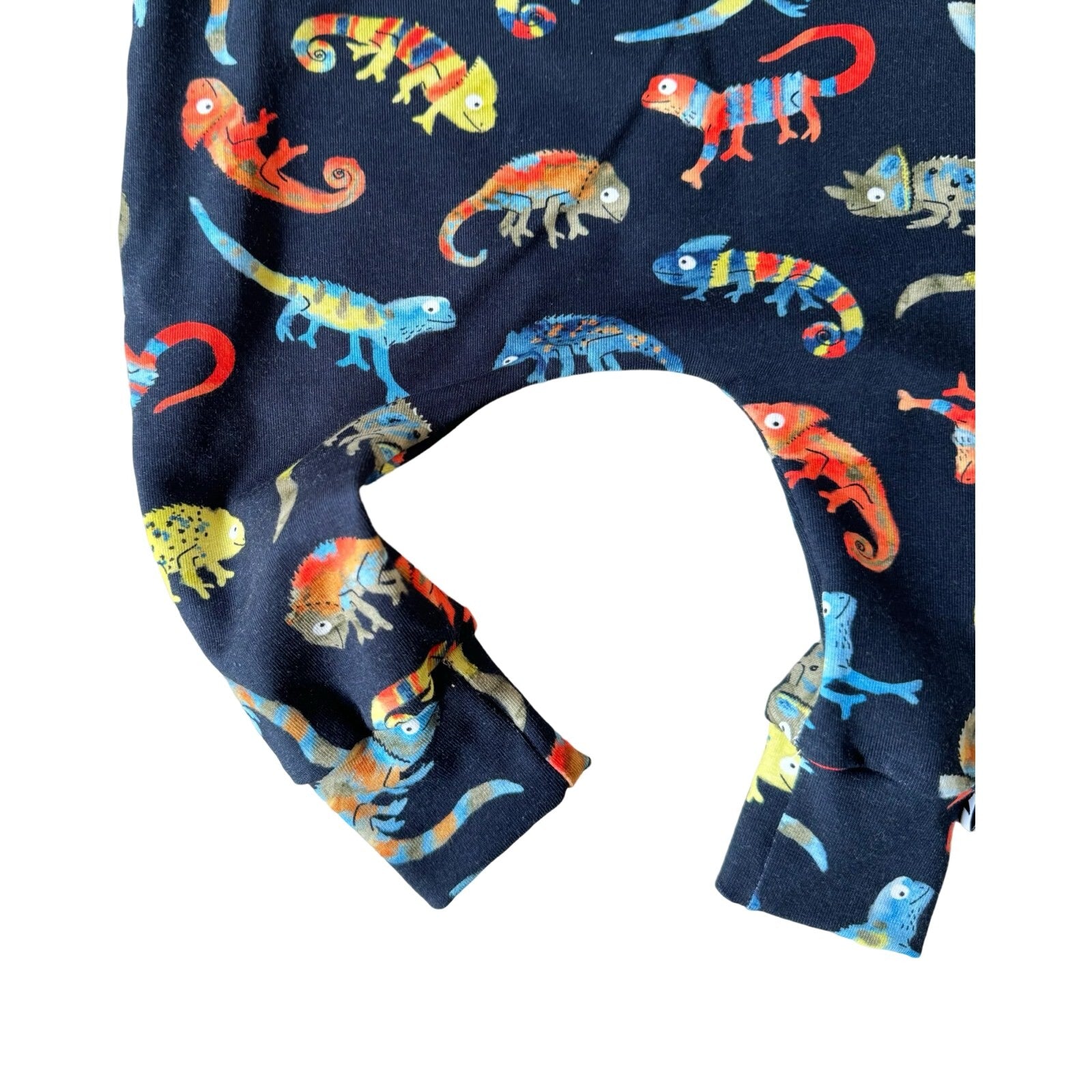 Navy cotton harem leggings with a pattern of colorful chameleons on the leg.