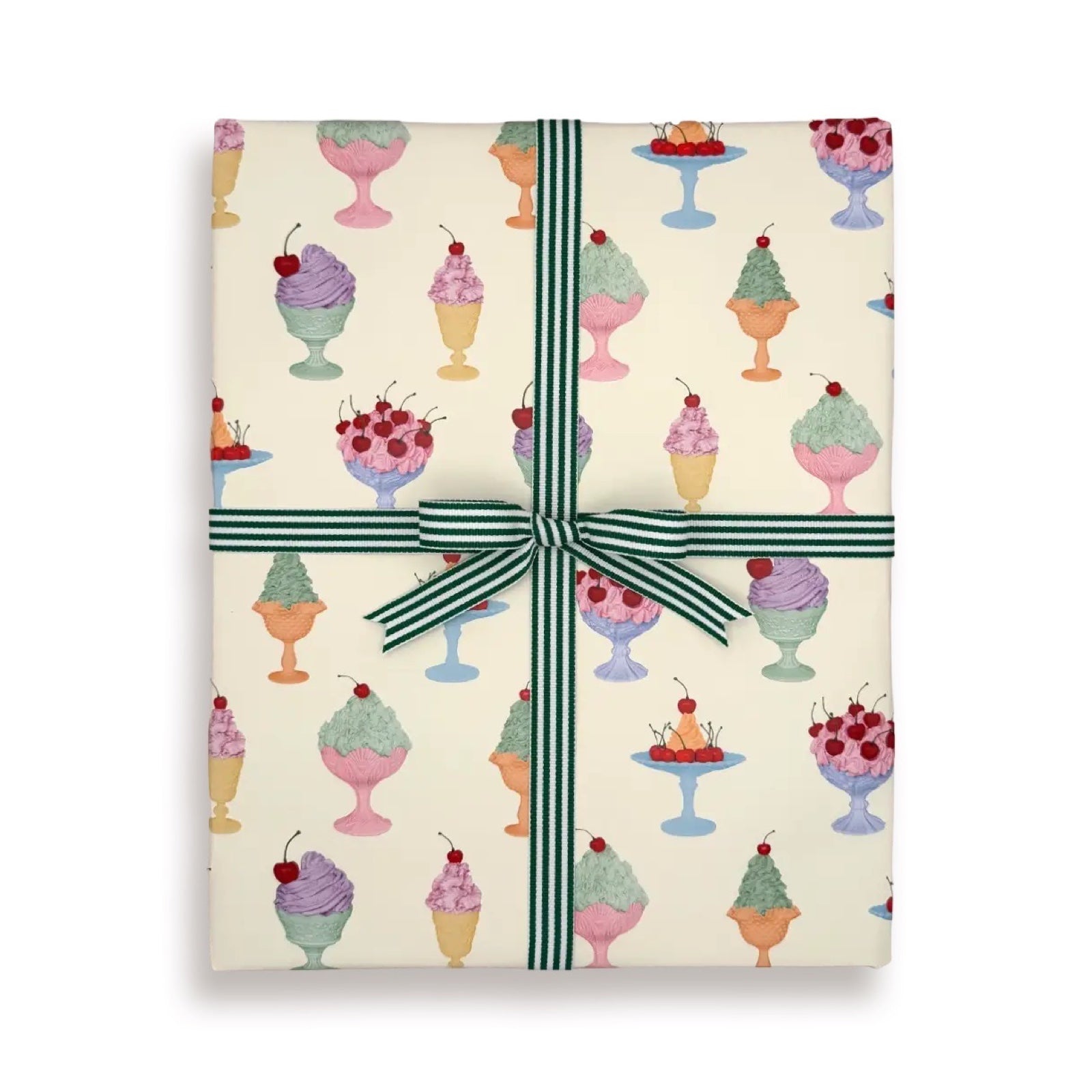 Gift wrap with chantilly cream patterns and a green ribbon on a white background.