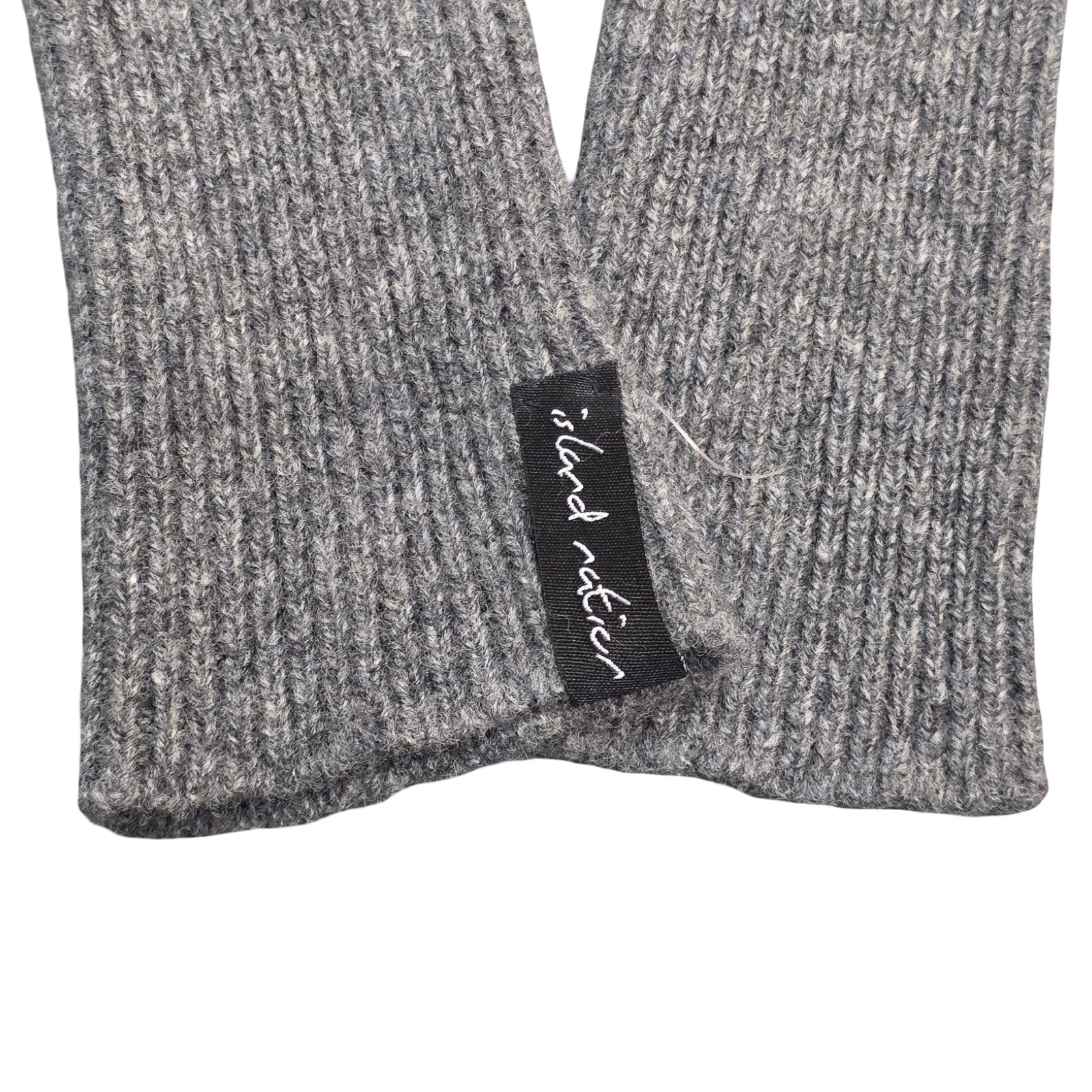 These charcoal grey ribbed woollen wrist warmers have been knitted using 100% light grey British lambswool. 