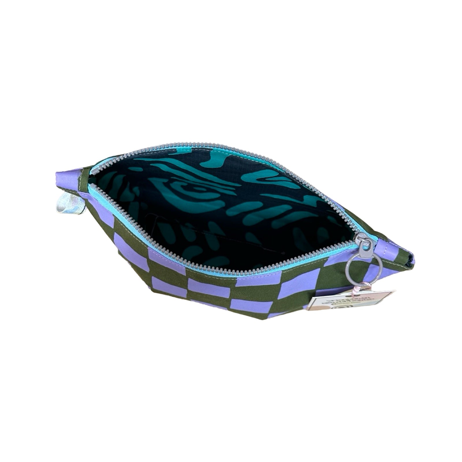 A grey and purple checked cosmetic bag open showing turquoise and blue abstract lining.
