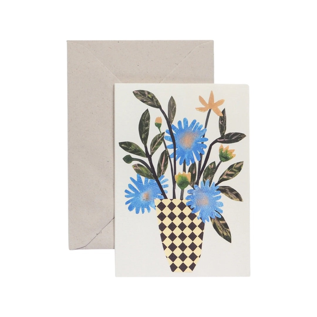 Floral card featuring an illustration of a bunch of blue flowers in a black and white checked vase.