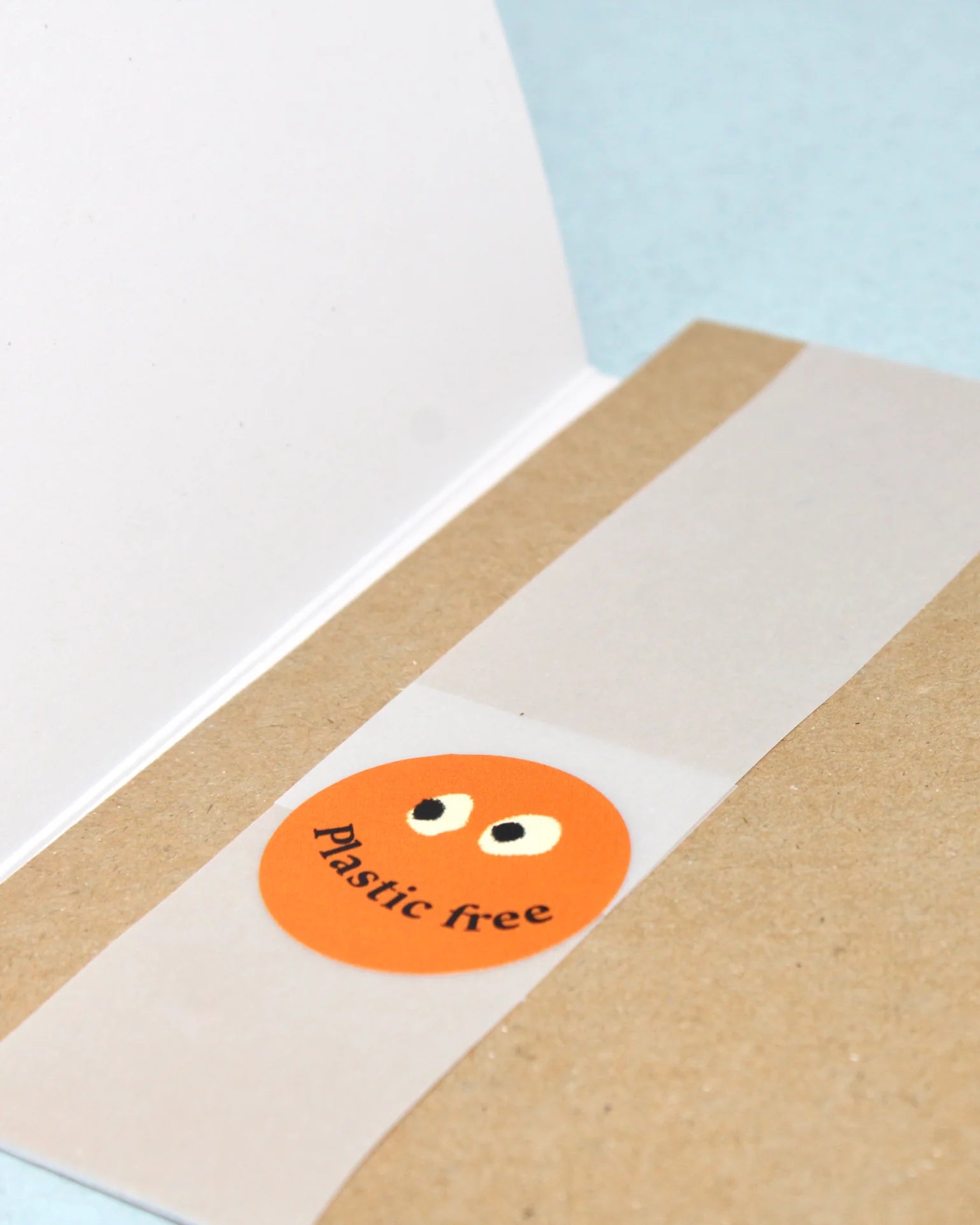 Card with a plastic free sticker on a brown envelope.