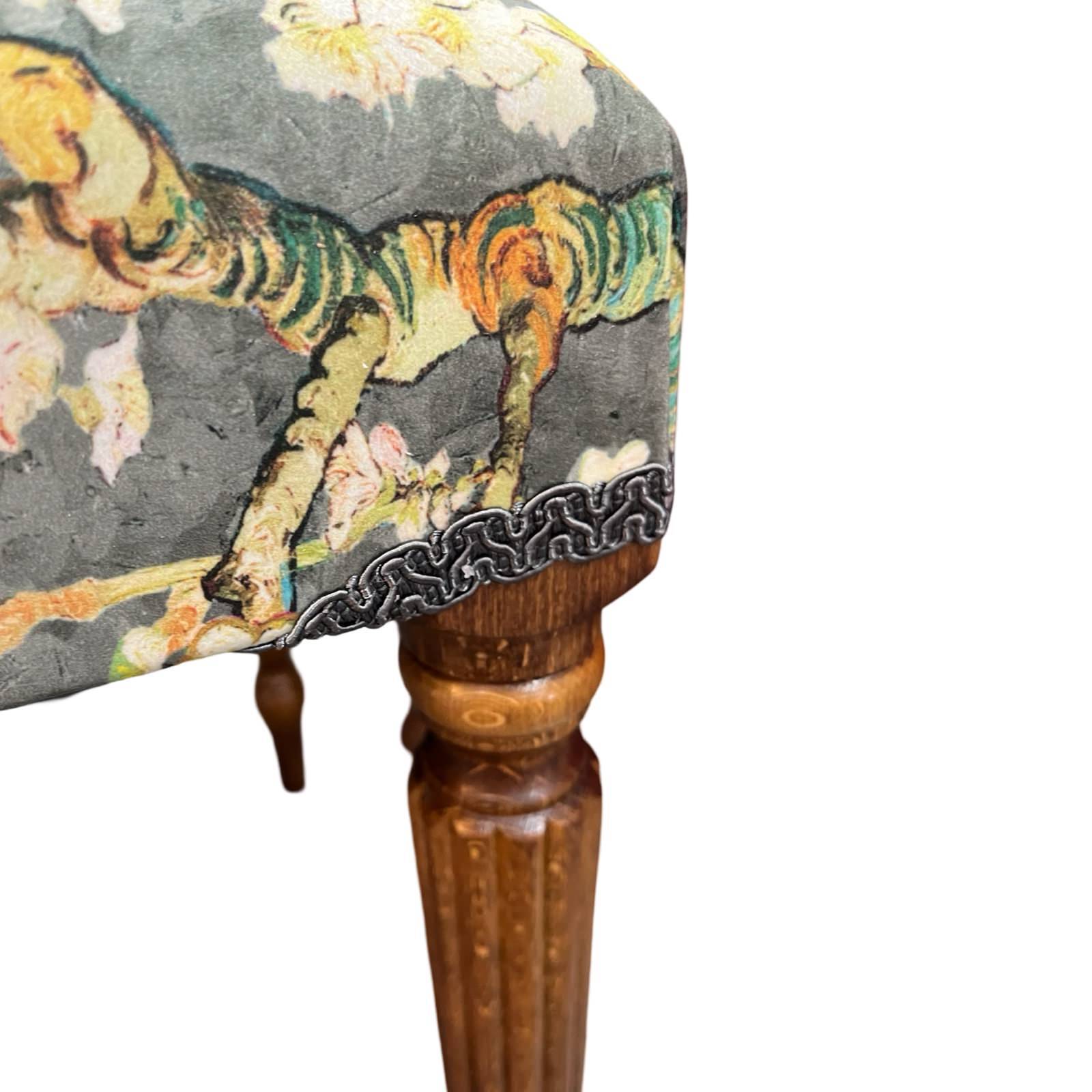 This bench is covered in luxurious grey velvet with white cherry blossom and finished with matching binding and mahogany legs.