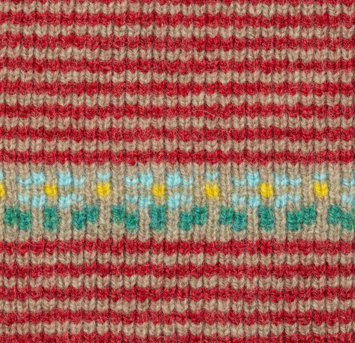 Textured snood with red, green, and yellow pattern.