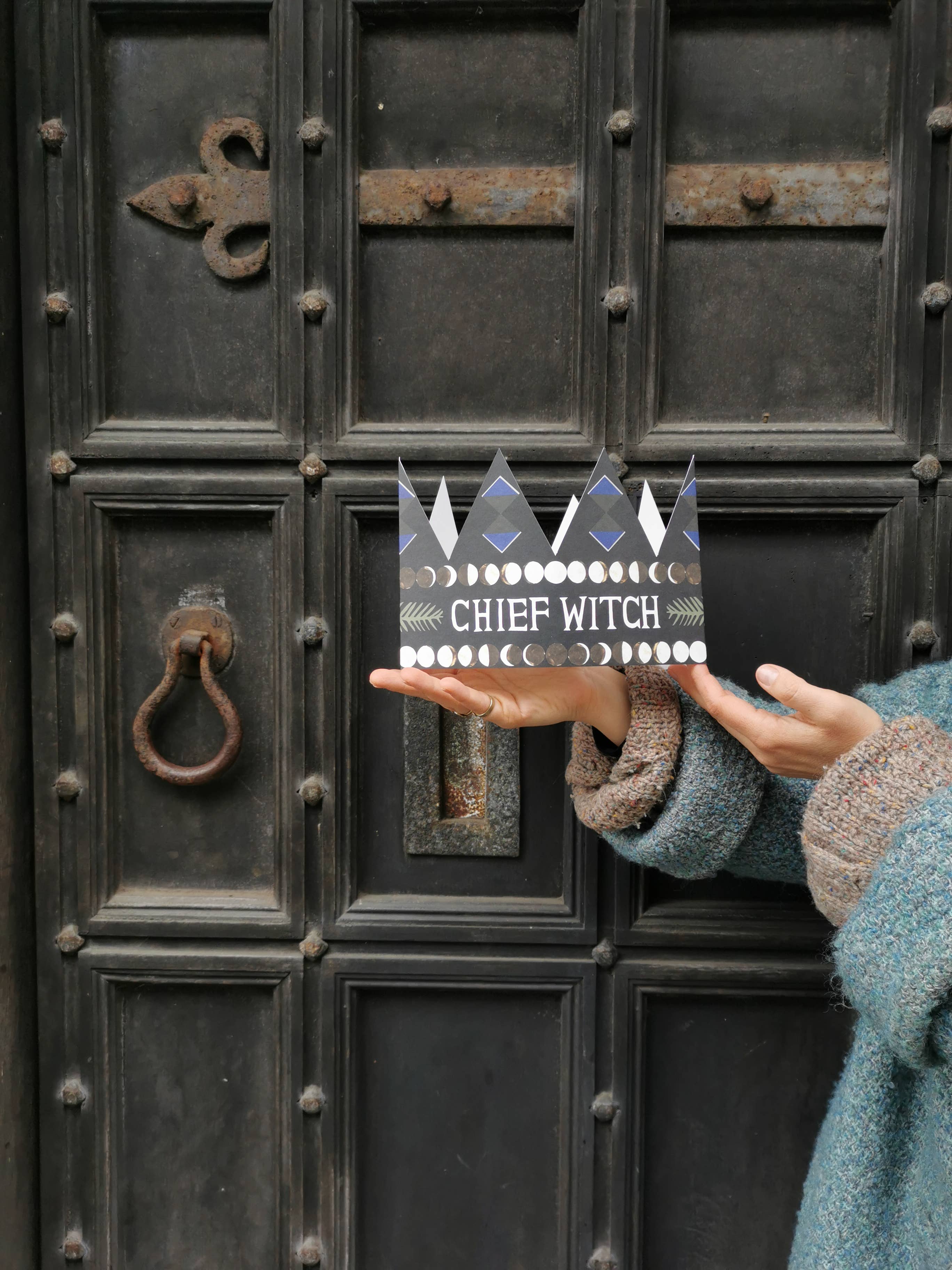 A crown-shaped card with a moon cycle motif with the text 'Chief Witch'.