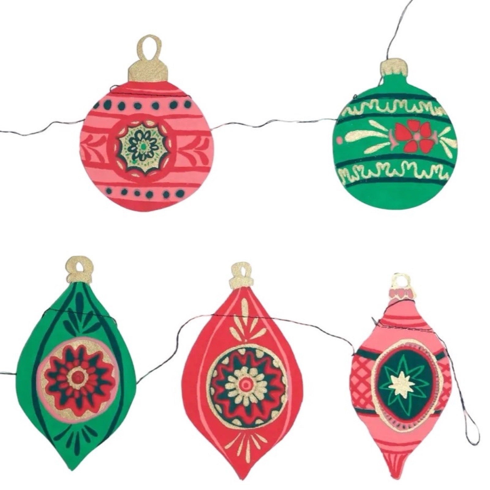Decorative Christmas ornaments on a string with a white background.