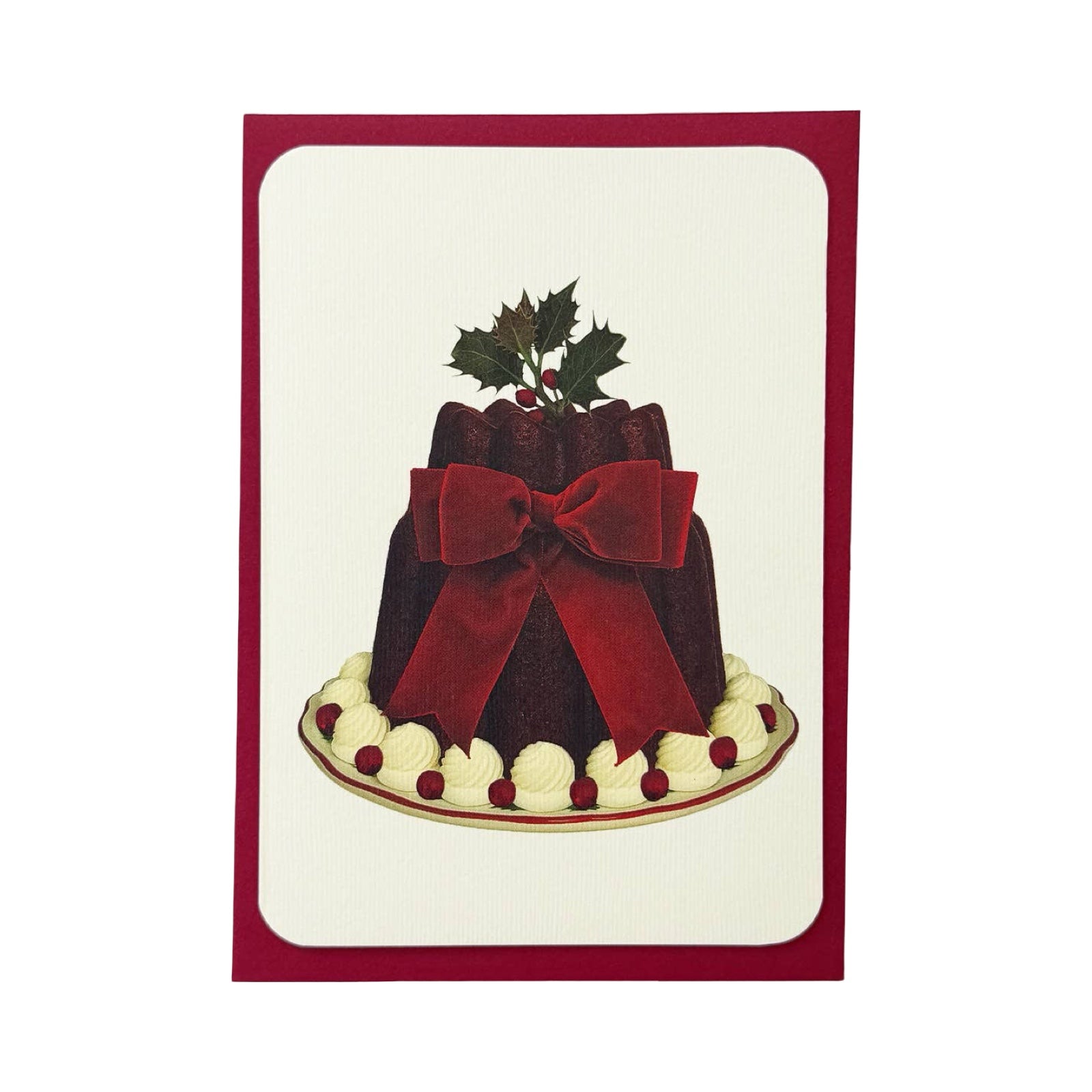 This Christmas card features an illustration of a delicious looking Christmas pudding tied with a giant red bow.