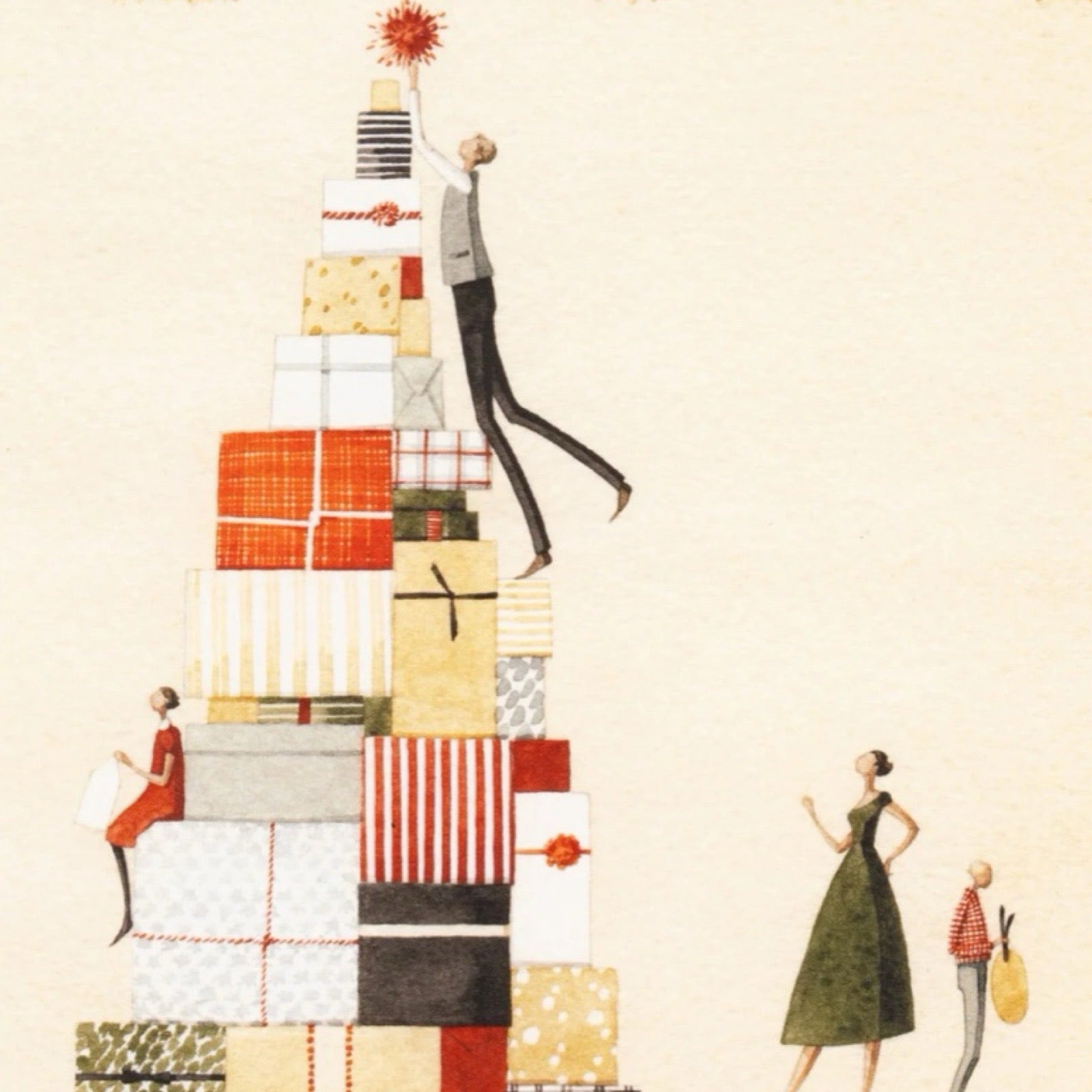  Christmas card featuring a family decorating a Christmas tree made out of Christmas presents. 