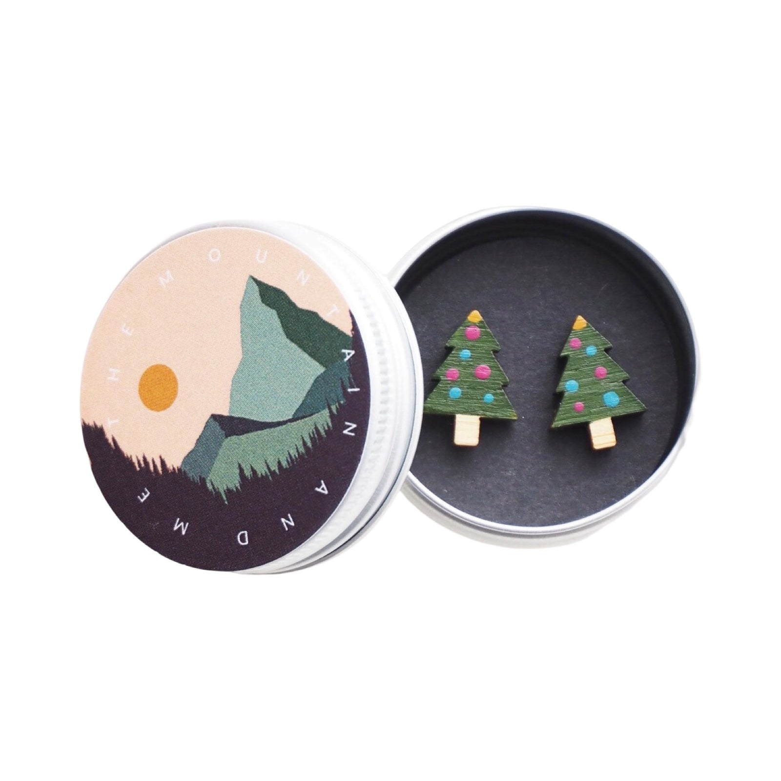 Green Christmas tree-shaped stud earrings with colourful painted baubles in a small metal tin