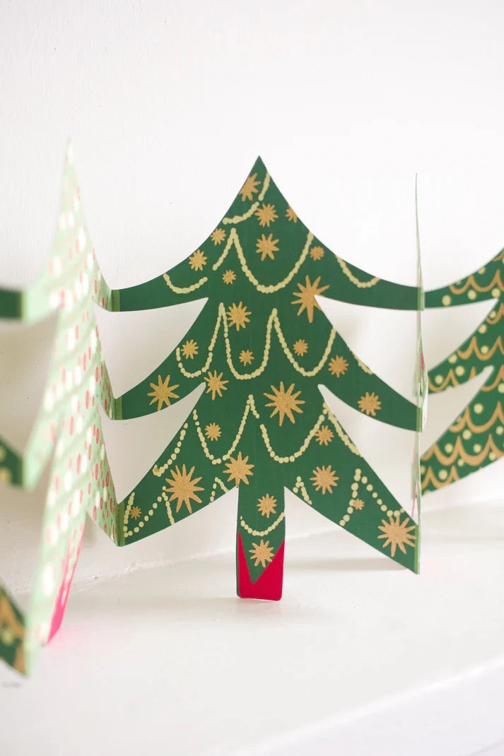 Decorative paper Christmas trees with gold embellishments on a white background.