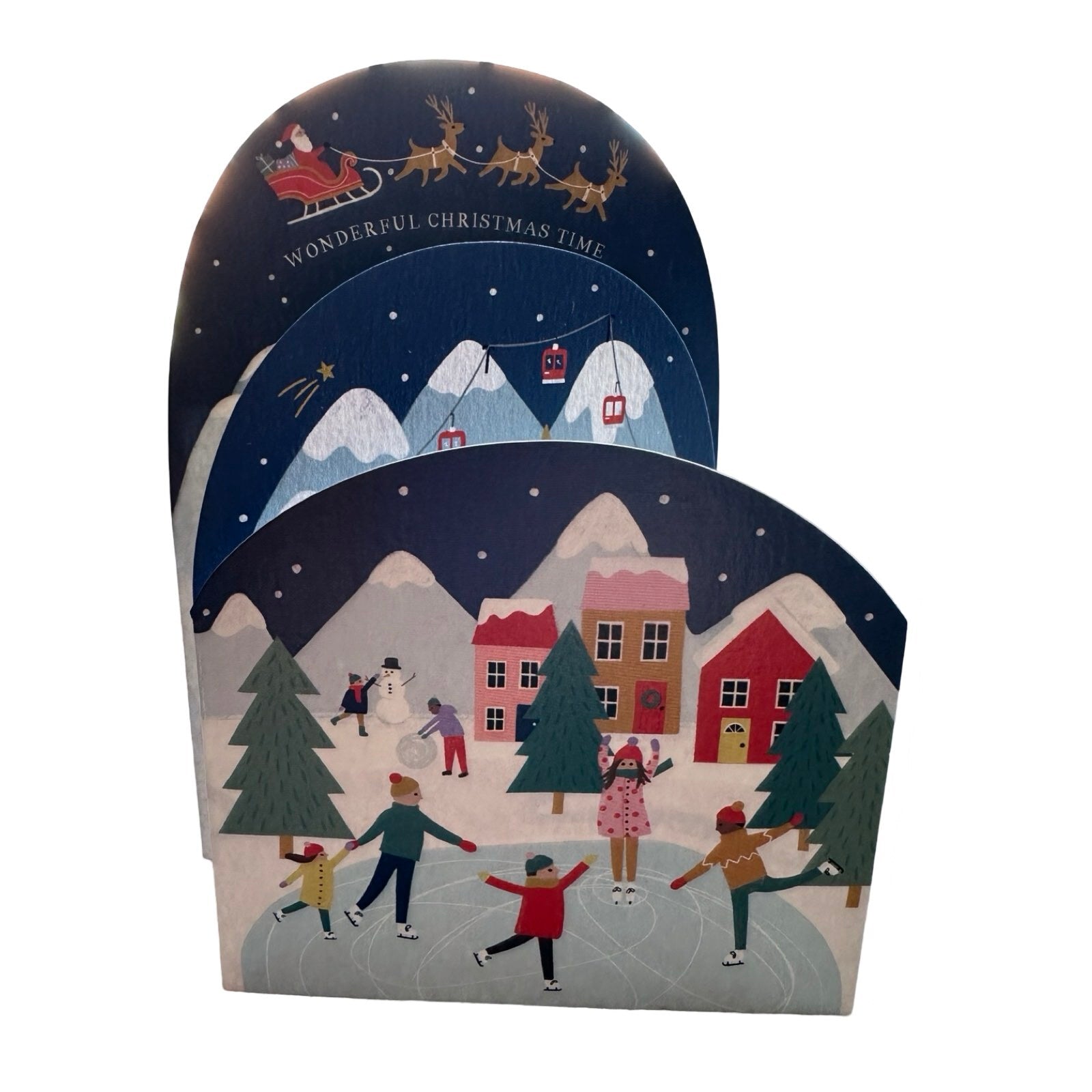 Concertina card of a snowy Christmas village, with ice skating, skiing, a choir, and Father Christmas. Text reads 'Wonderful Christmas Time'.