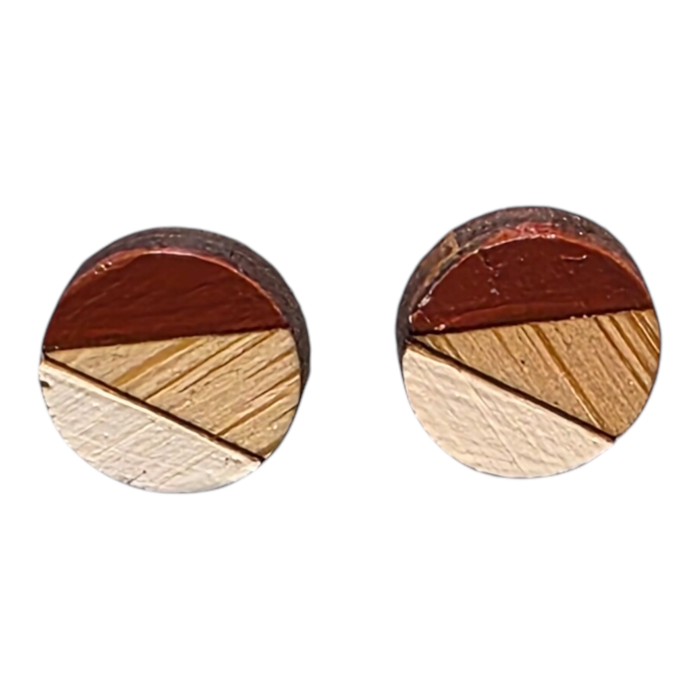 A pair of red and white painted circular wooden stud earrings.