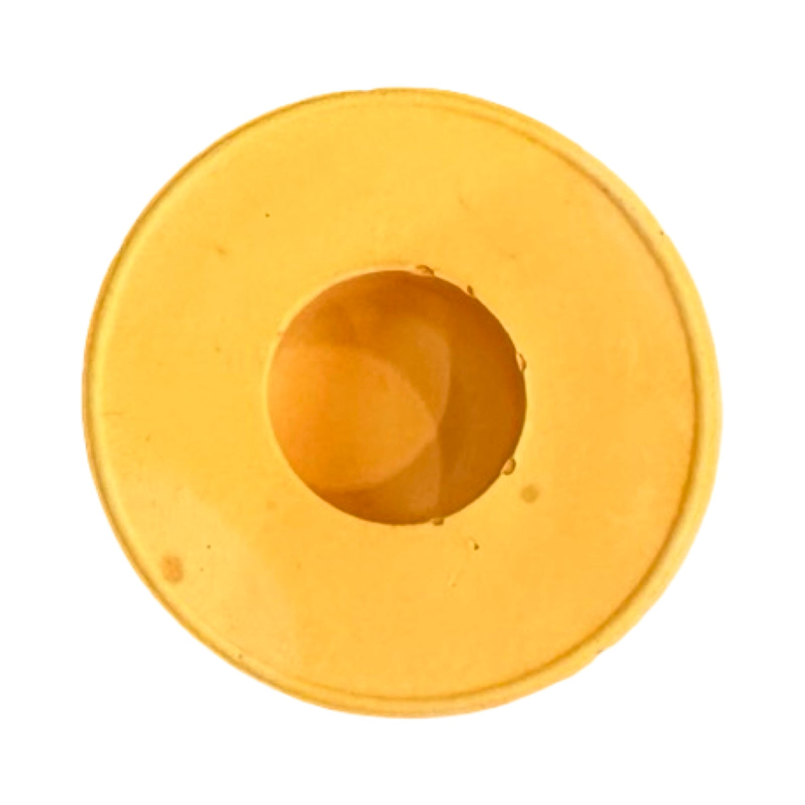 The top of a small circular dinner candle holder in orange.